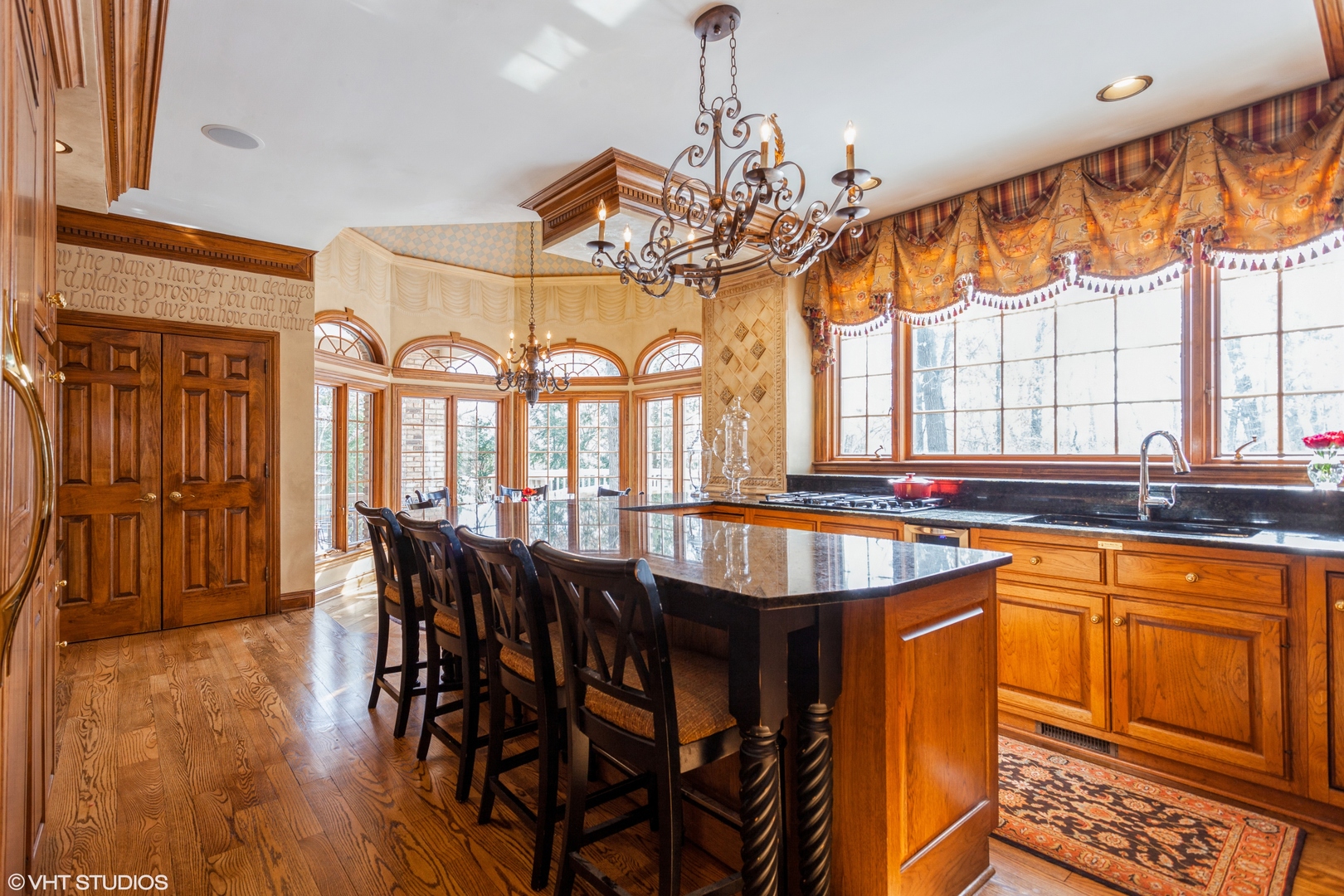 136 Circle Ridge Drive Burr Ridge, IL 60527 - Photo 24 of 38 a dining hall with stainless steel appliances granite countertop a stove and a dining table with wooden floor