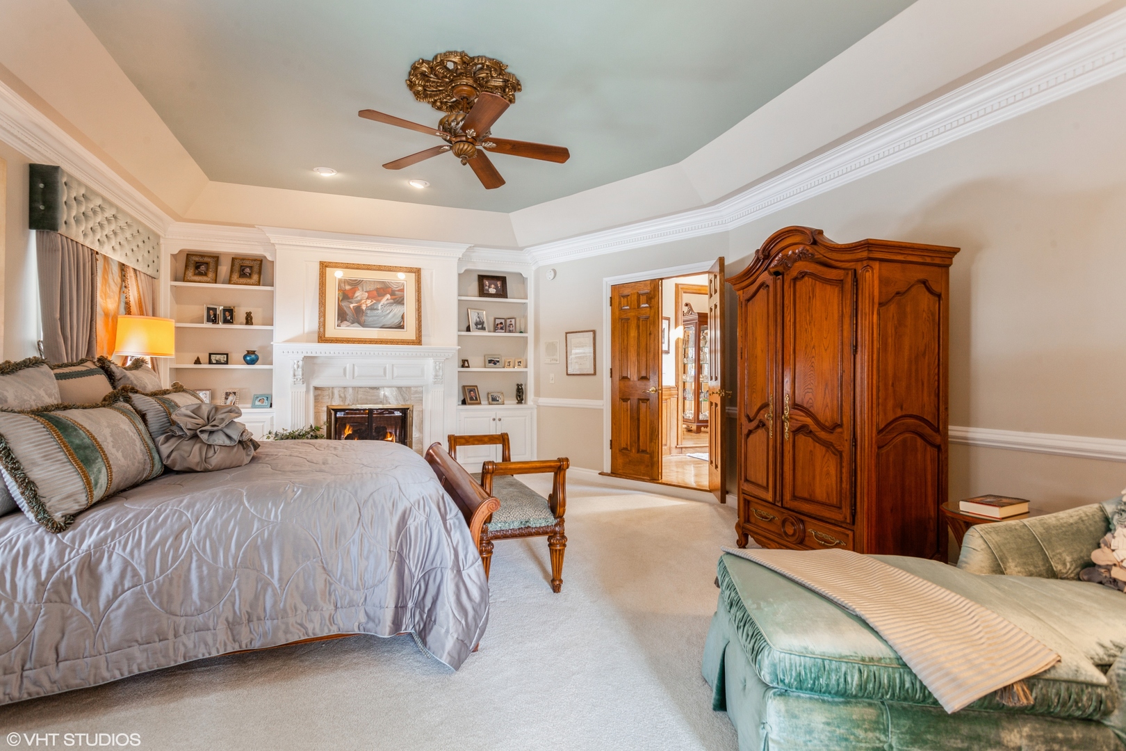 136 Circle Ridge Drive Burr Ridge, IL 60527 - Photo 26 of 38 a spacious bedroom with a large bed and a chandelier
