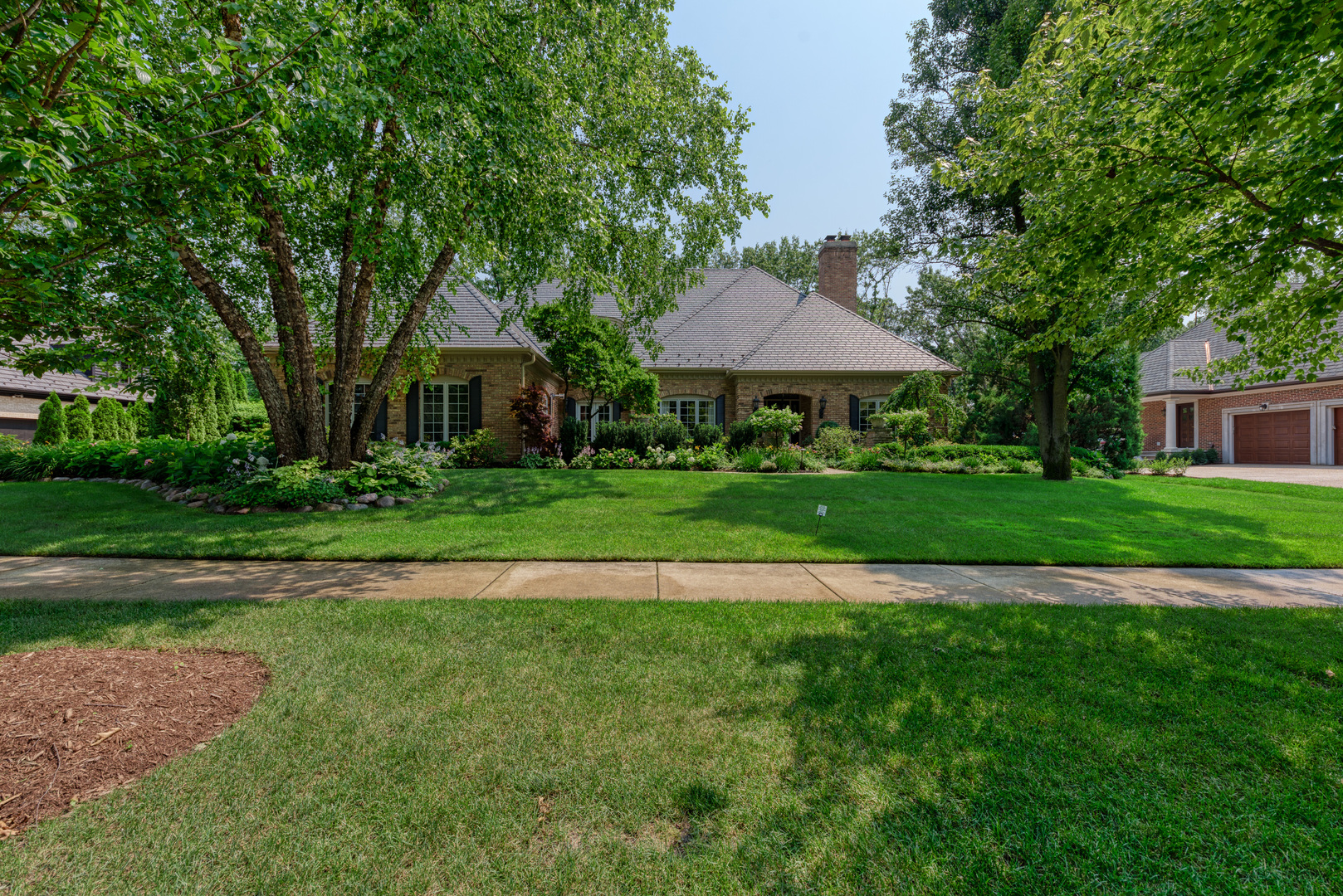 136 Circle Ridge Drive Burr Ridge, IL 60527 - Photo 5 of 38 a front view of a house with a yard
