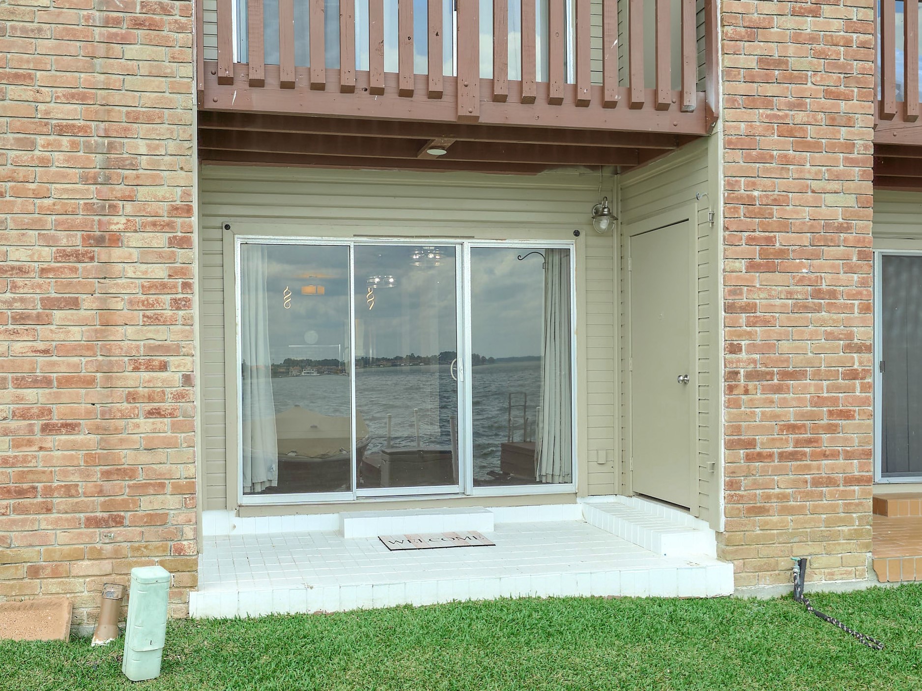 801 River Road, Unit E111 Montgomery, TX 77356 - Photo 21 of 26 Close up of your covered back patio. Note the storage door on the right. Great storage for your water toys, fishing pools, etc.