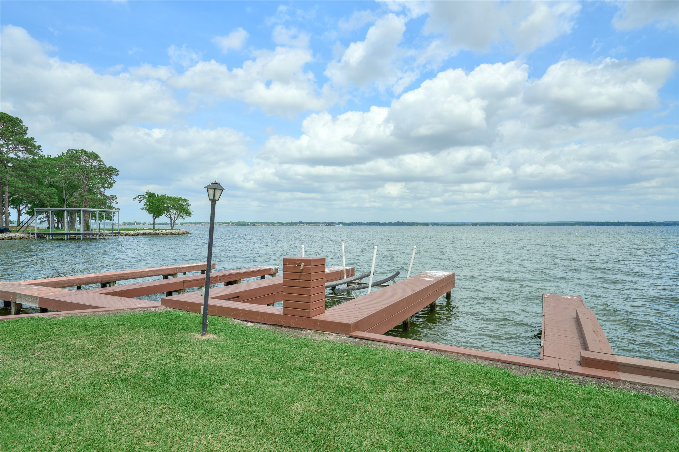 801 River Road, Unit E111 Montgomery, TX 77356 - Photo 22 of 26 boats slips #93, #94 & #95 will convey with the sale of the condo. #94 is in the middle & features a boat lift.