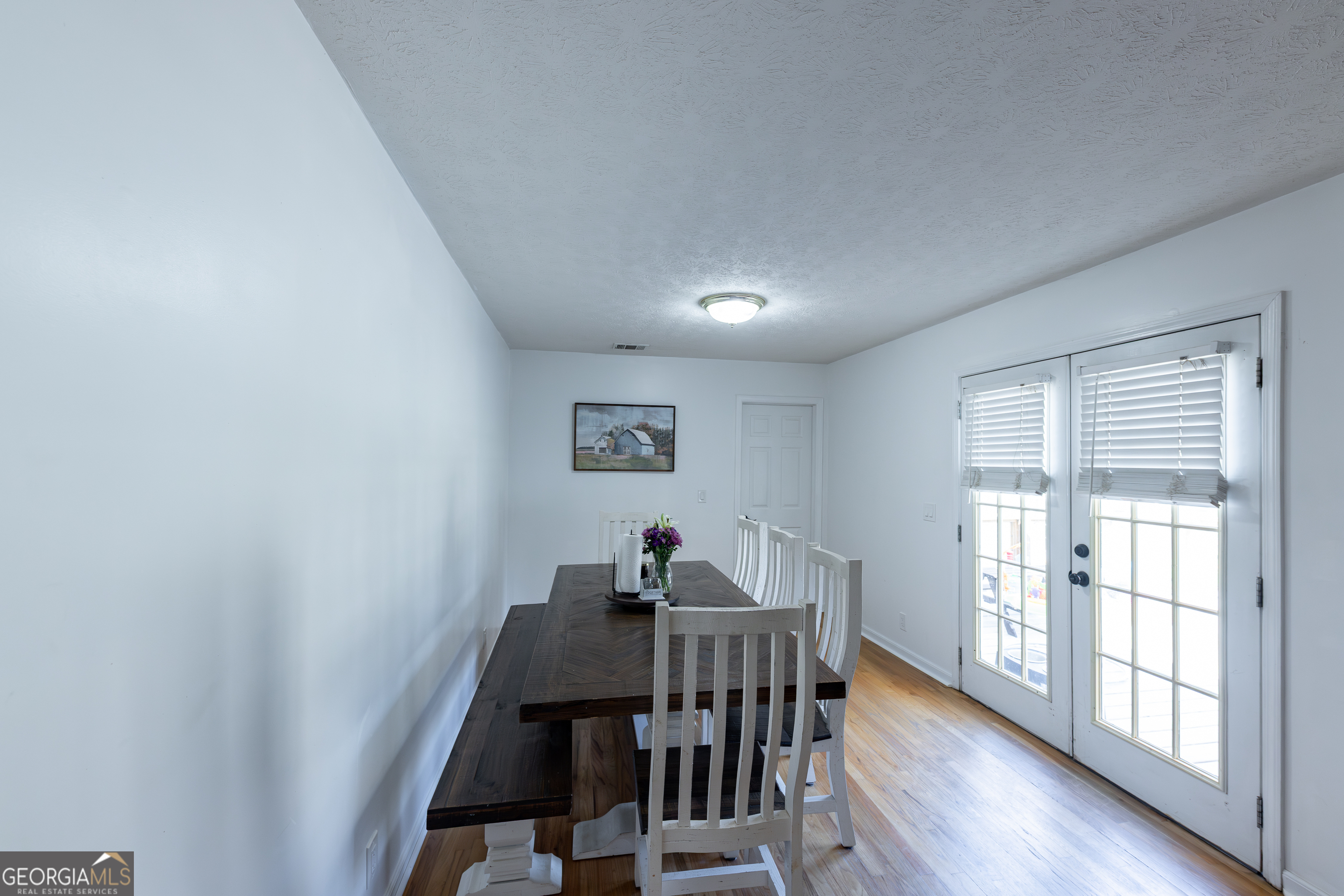 647 Pine Valley Road Meansville, GA 30256 - Photo 11 of 92 a view of a dining room with furniture window and wooden floor