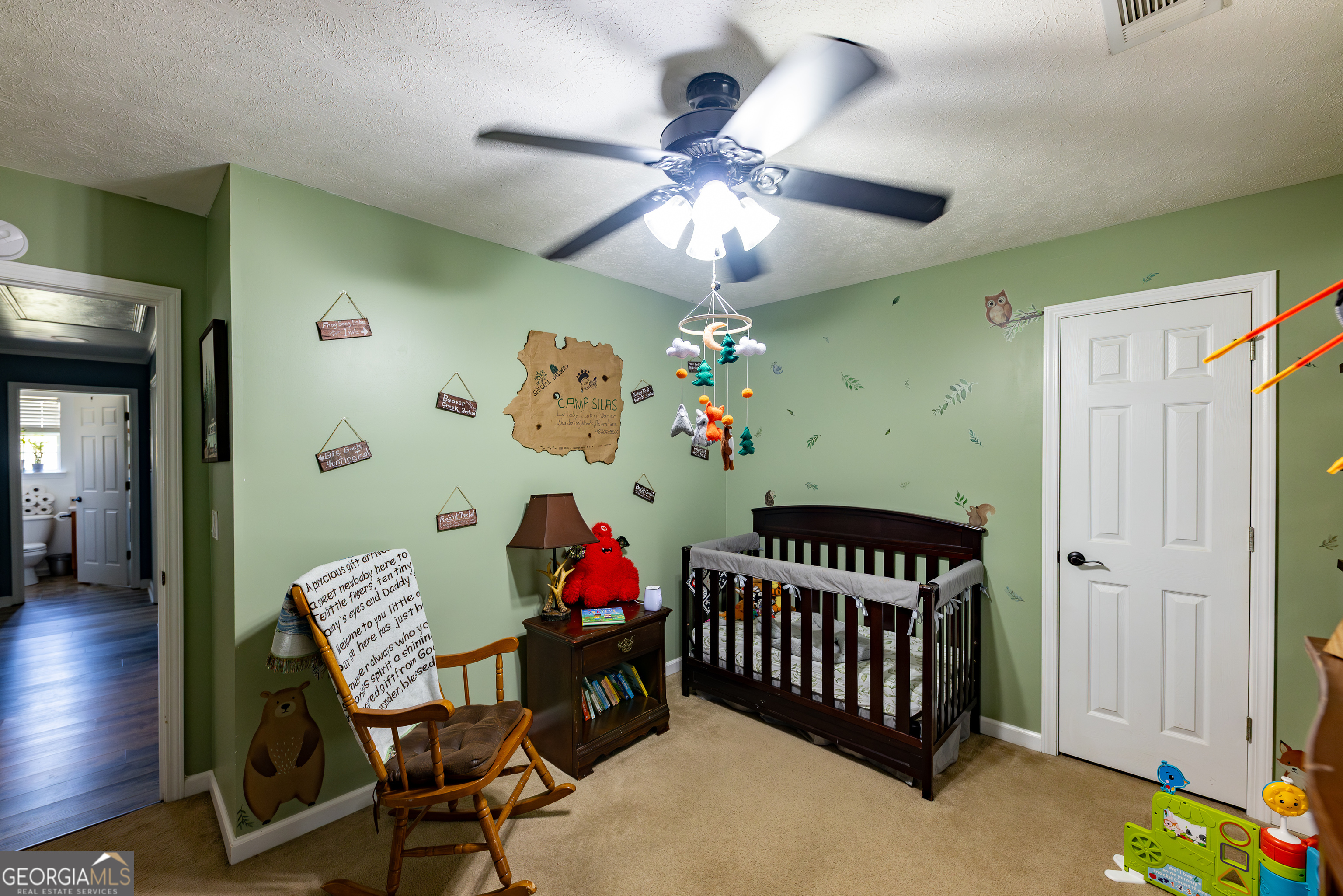647 Pine Valley Road Meansville, GA 30256 - Photo 13 of 92 a view of kids room with toys and a chandelier