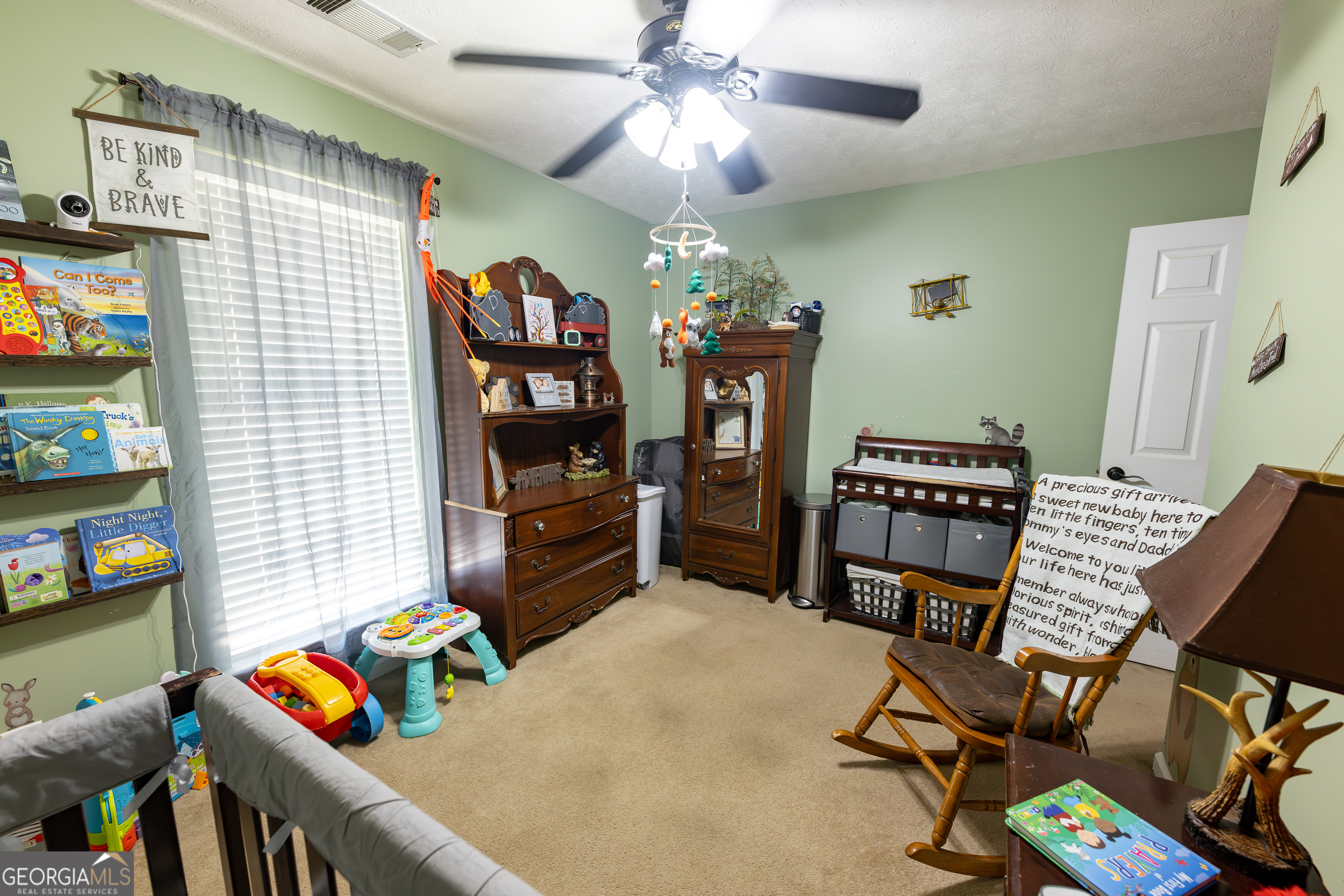 647 Pine Valley Road Meansville, GA 30256 - Photo 14 of 92 a bedroom with furniture and a book shelf