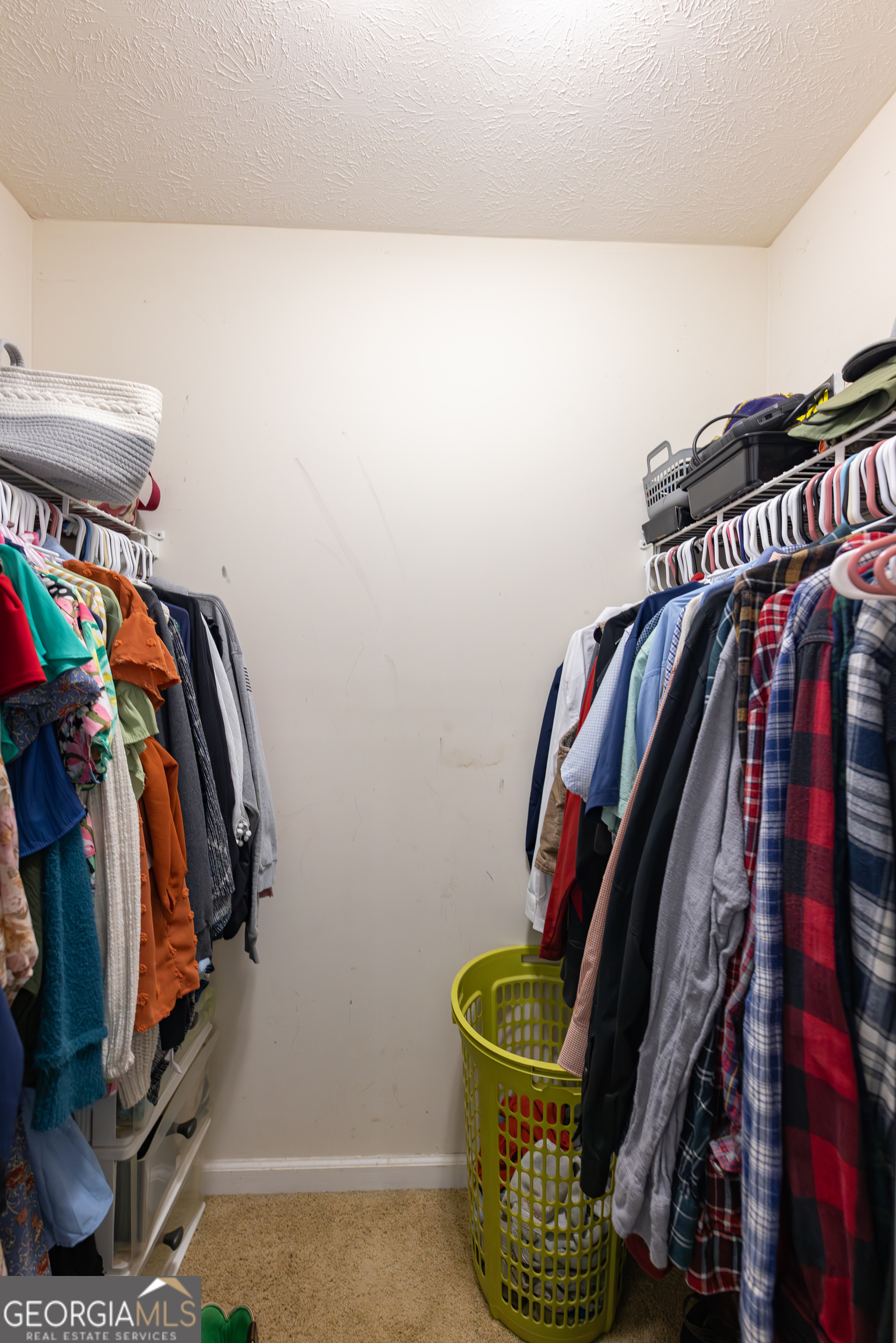 647 Pine Valley Road Meansville, GA 30256 - Photo 24 of 92 a view of walk in closet with clothes and shoes