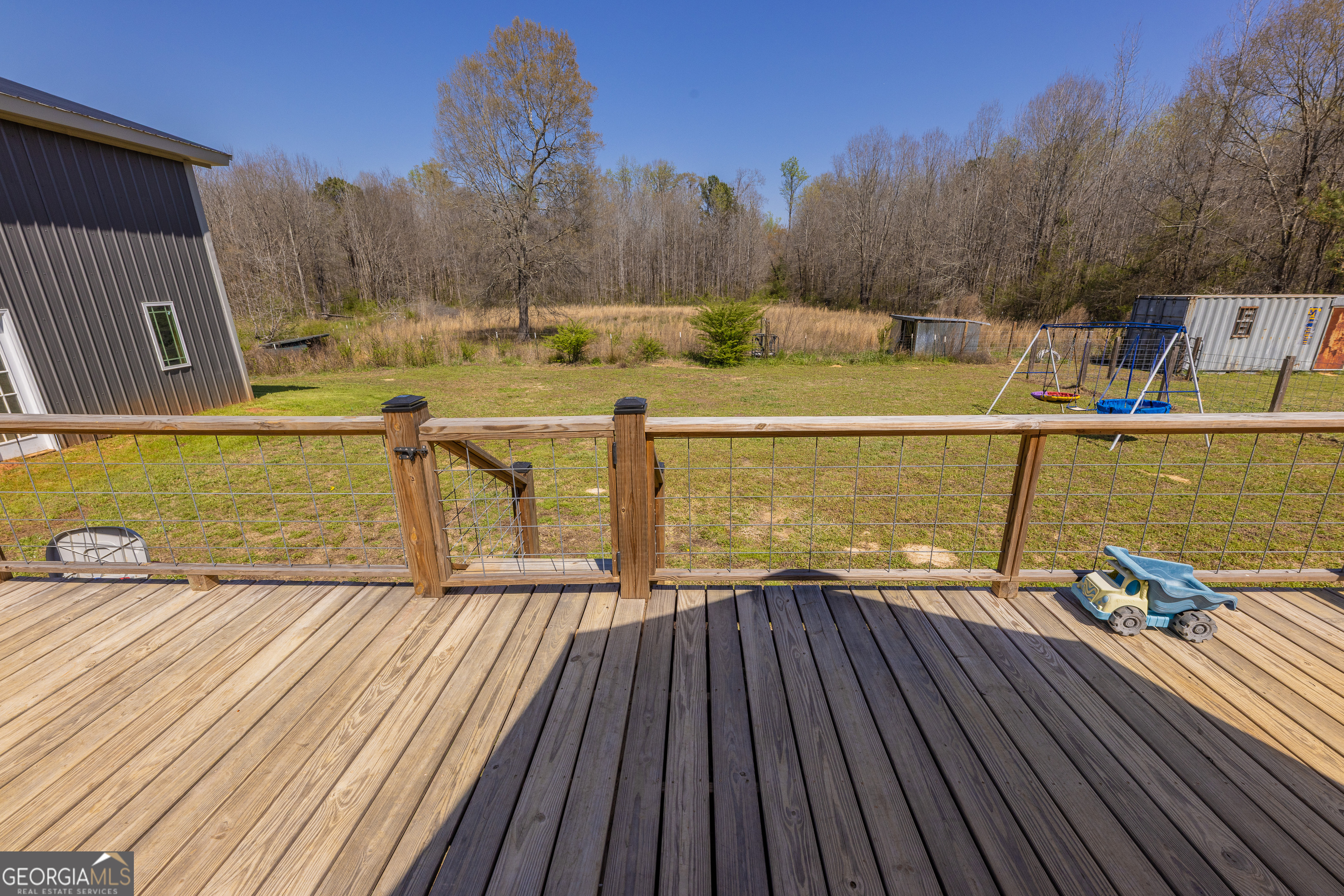 647 Pine Valley Road Meansville, GA 30256 - Photo 29 of 92 a view of a balcony with wooden floor