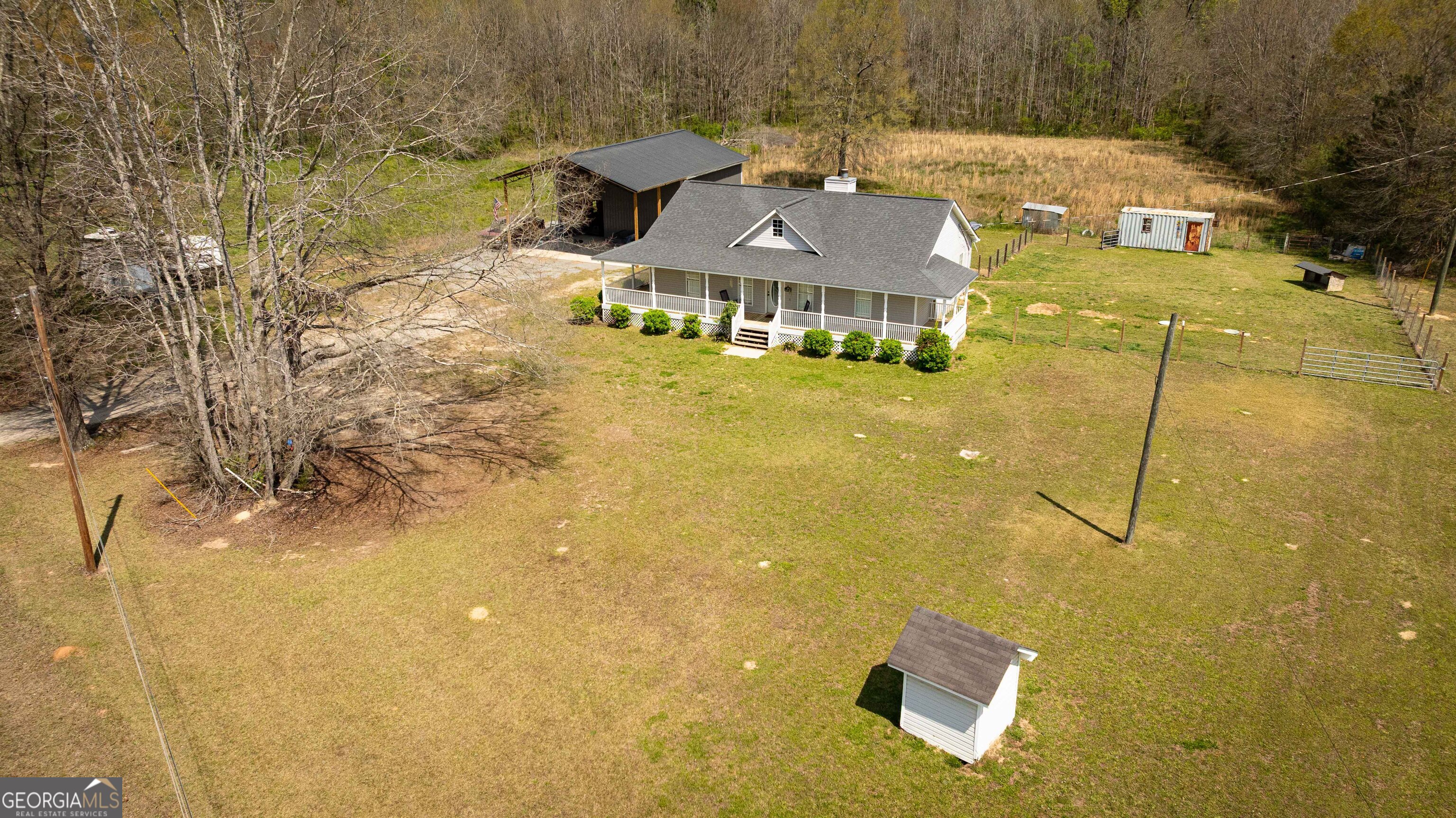 647 Pine Valley Road Meansville, GA 30256 - Photo 3 of 92 a aerial view of residential houses with swimming pool