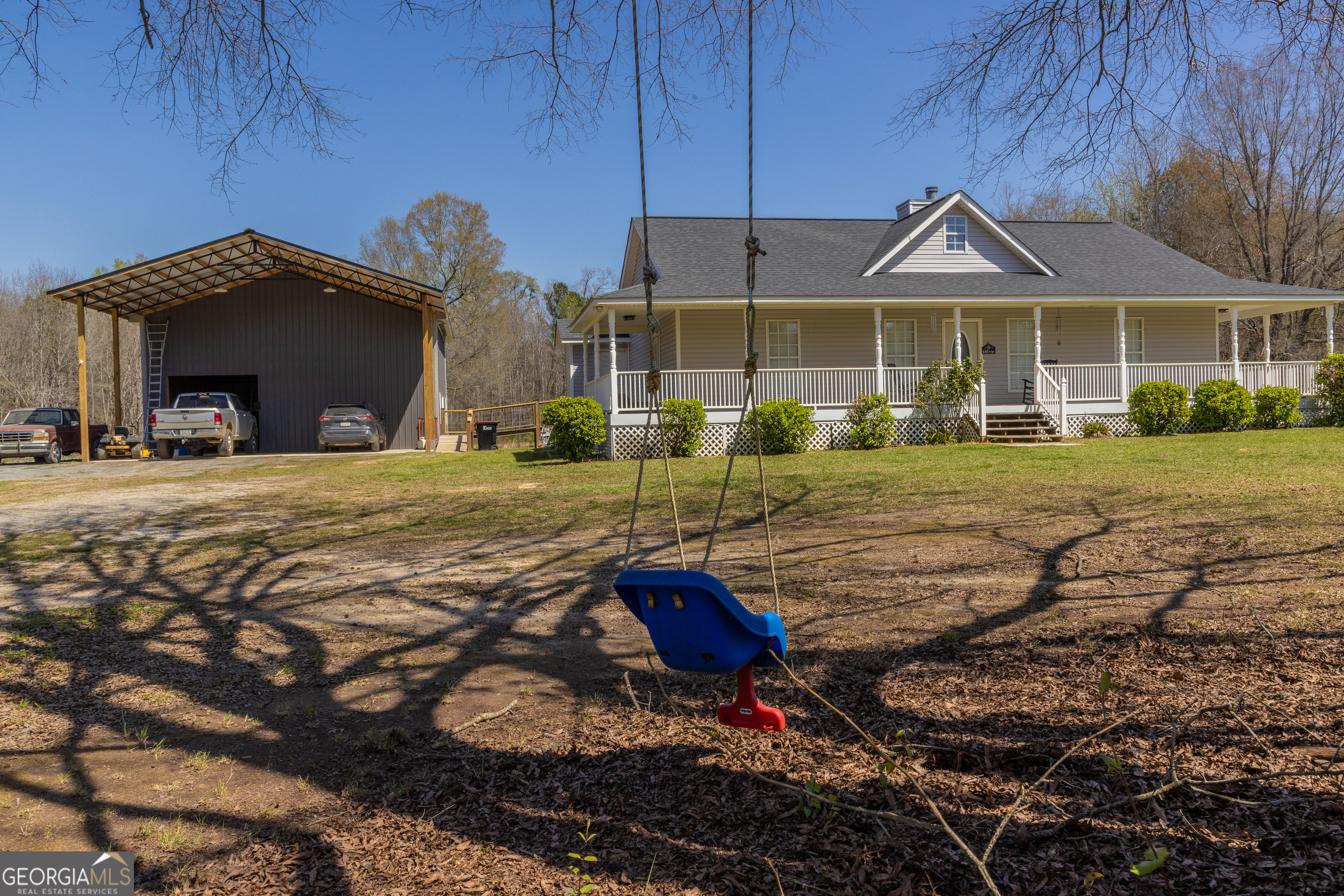 647 Pine Valley Road Meansville, GA 30256 - Photo 45 of 92 a front view of a house with a yard