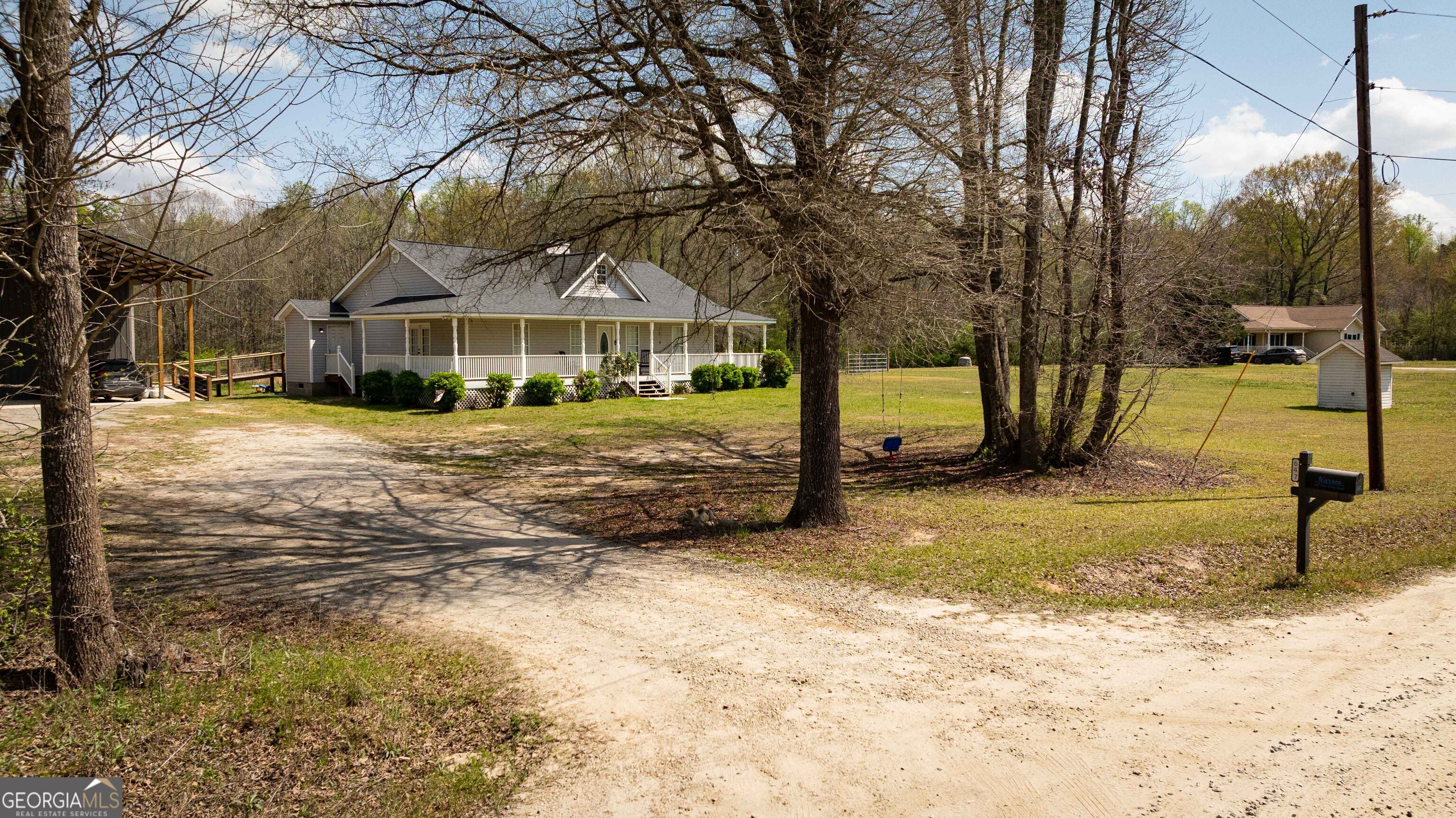647 Pine Valley Road Meansville, GA 30256 - Photo 50 of 92 a view of a house with a yard covered in snow