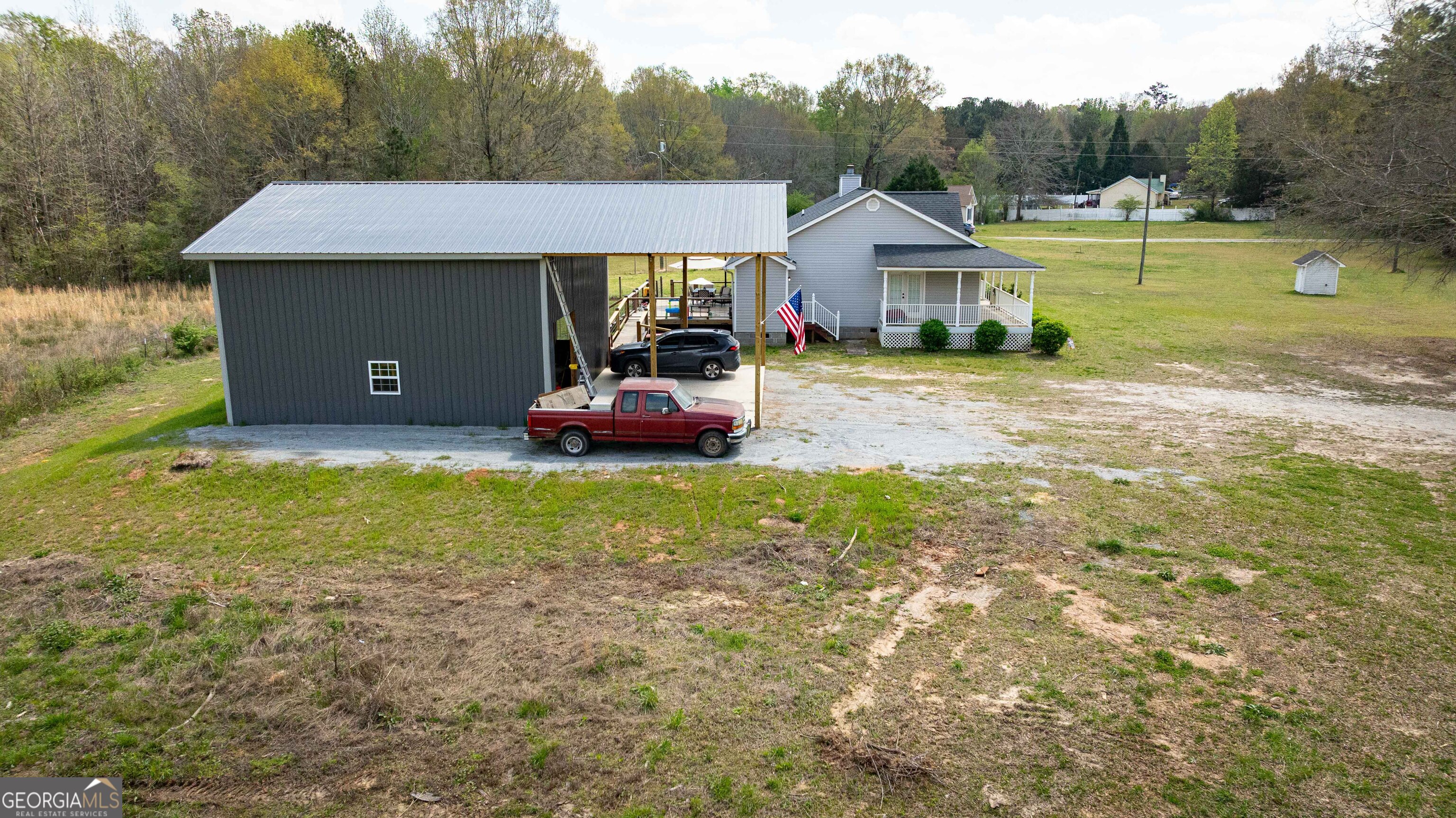 647 Pine Valley Road Meansville, GA 30256 - Photo 58 of 92 a front view of a house with garden