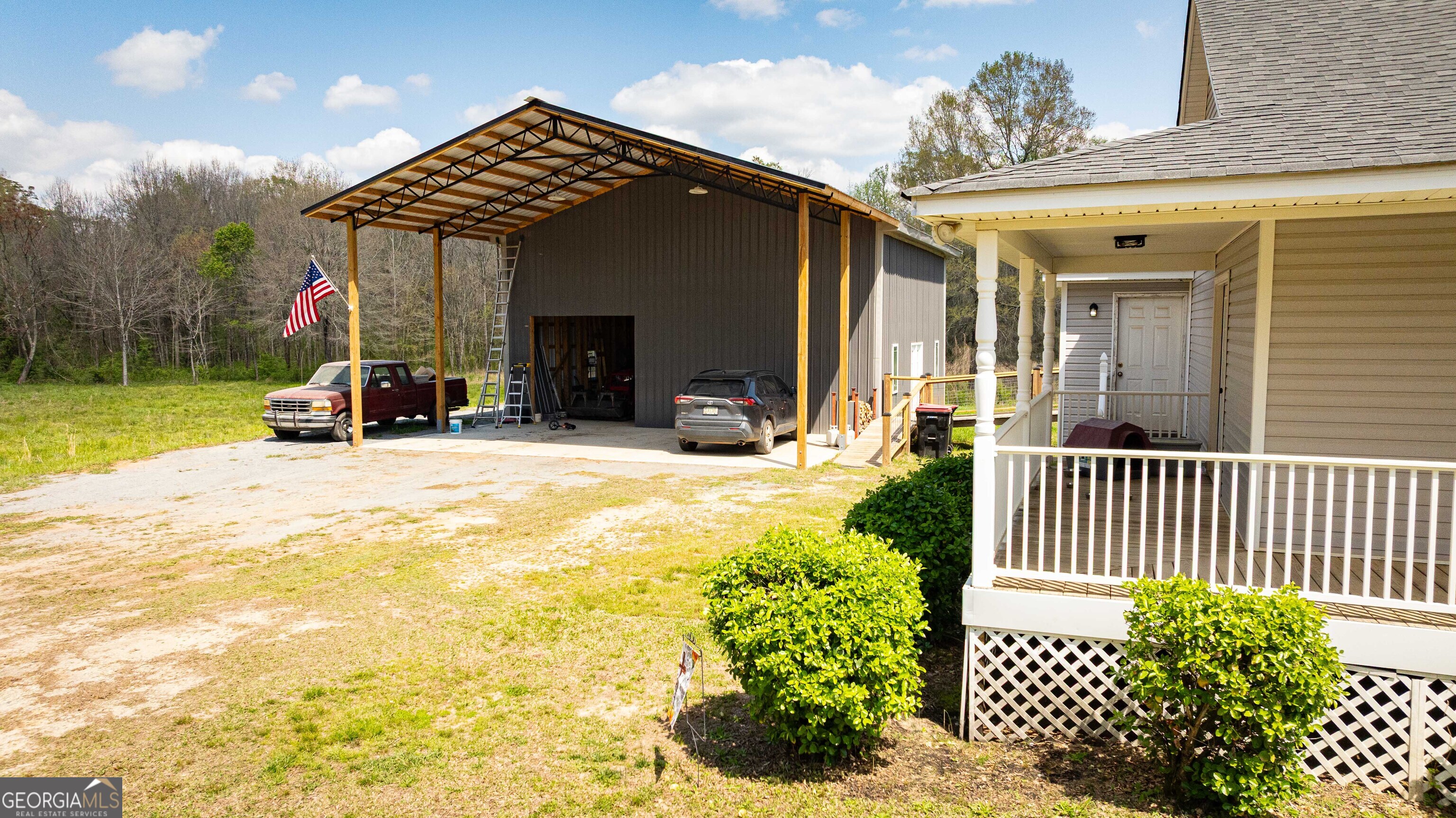 647 Pine Valley Road Meansville, GA 30256 - Photo 64 of 92 a view of a chair and tables in the patio of the house