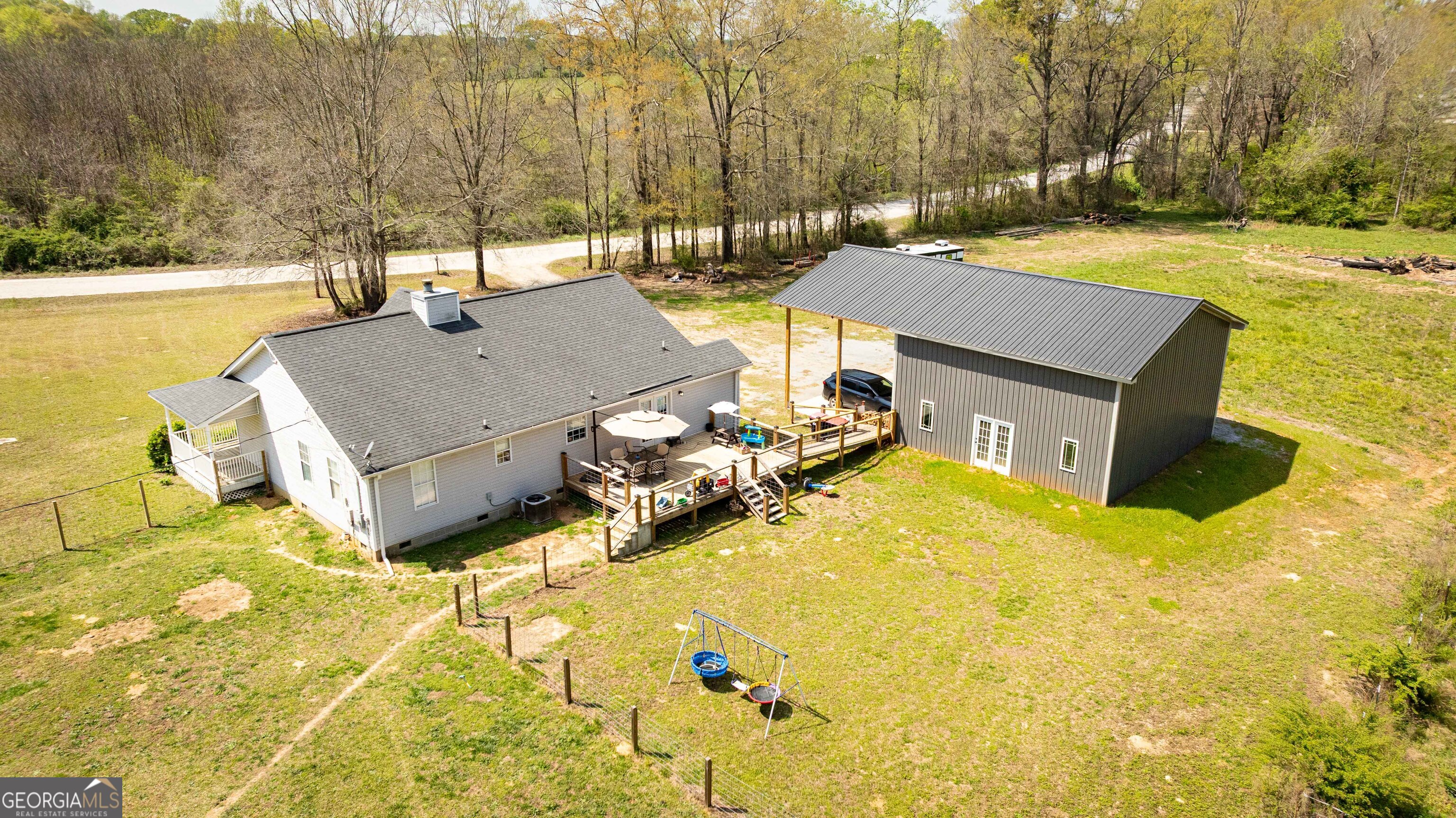 647 Pine Valley Road Meansville, GA 30256 - Photo 70 of 92 a view of a swimming pool with an outdoor space and seating area