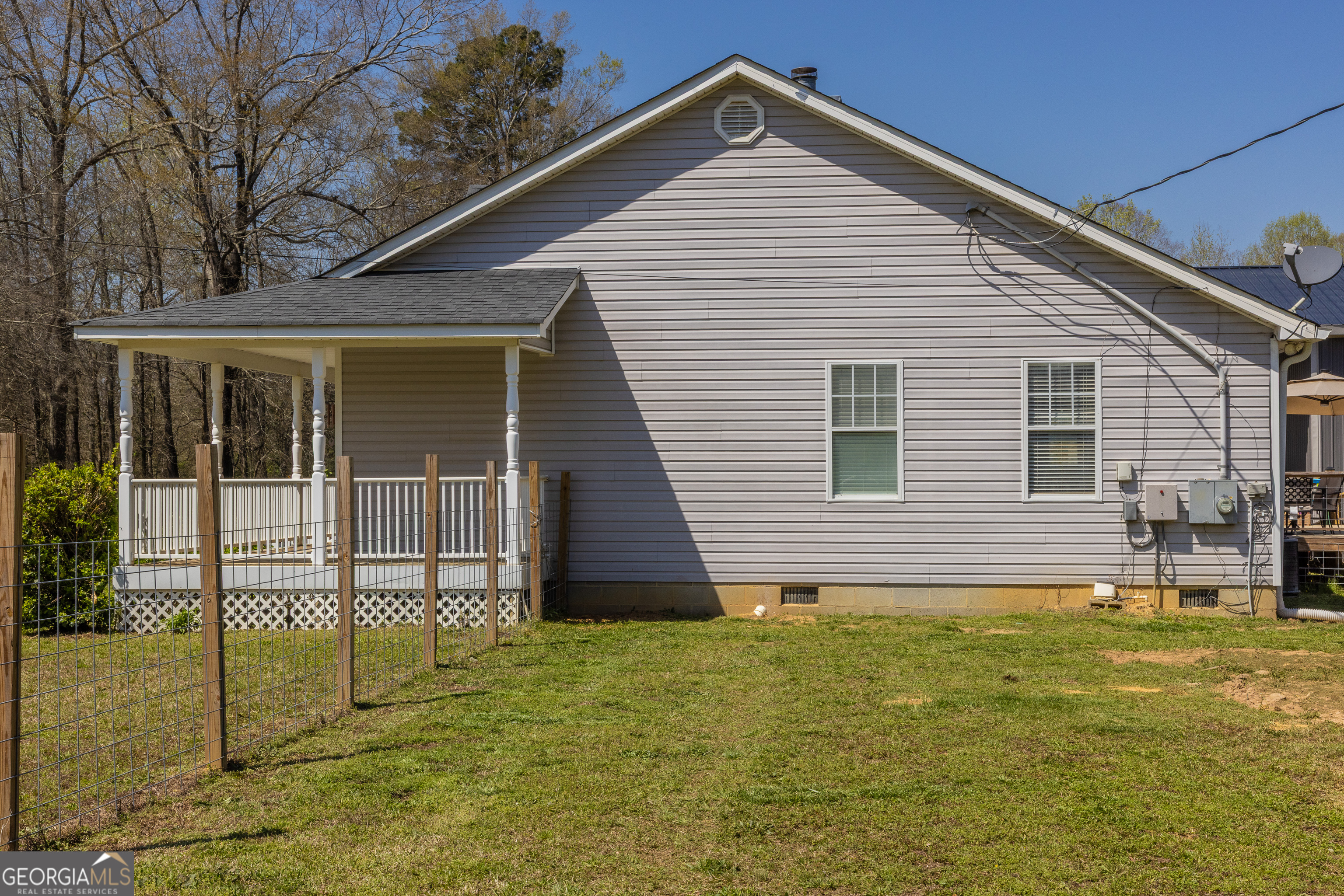 647 Pine Valley Road Meansville, GA 30256 - Photo 78 of 92 a front view of a house with a yard