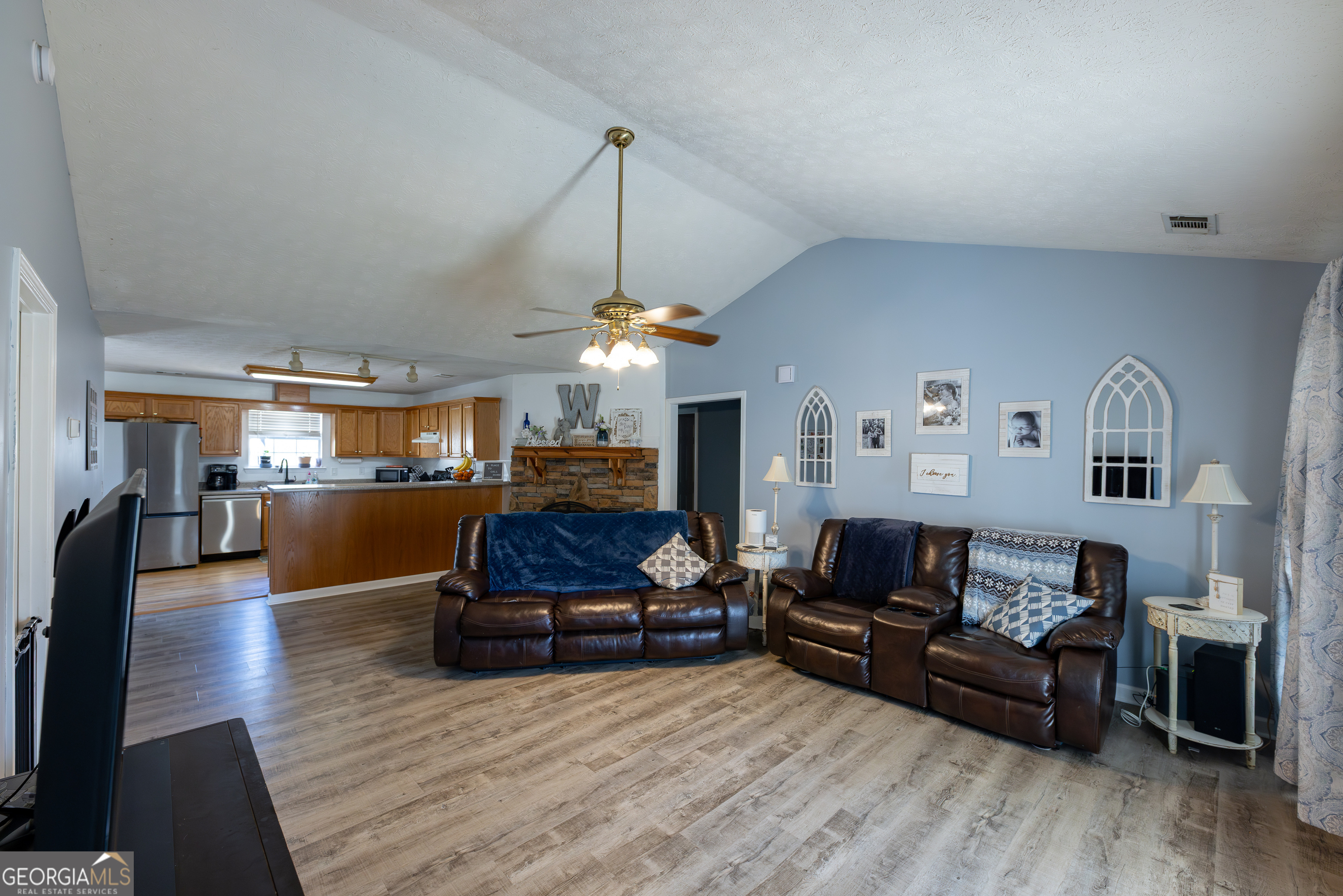 647 Pine Valley Road Meansville, GA 30256 - Photo 8 of 92 a living room with furniture and a chandelier