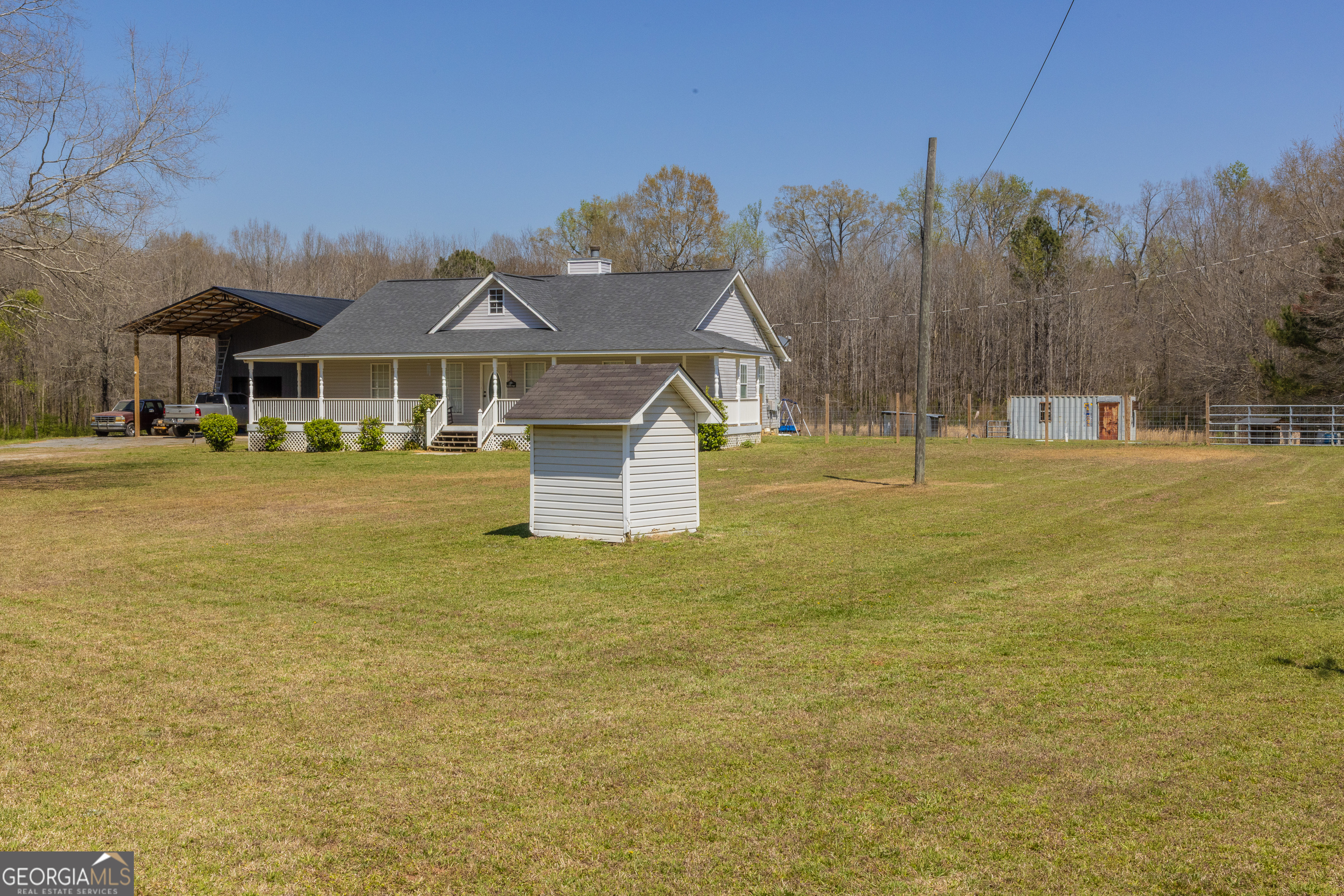 647 Pine Valley Road Meansville, GA 30256 - Photo 81 of 92 a view of a large house with a swimming pool