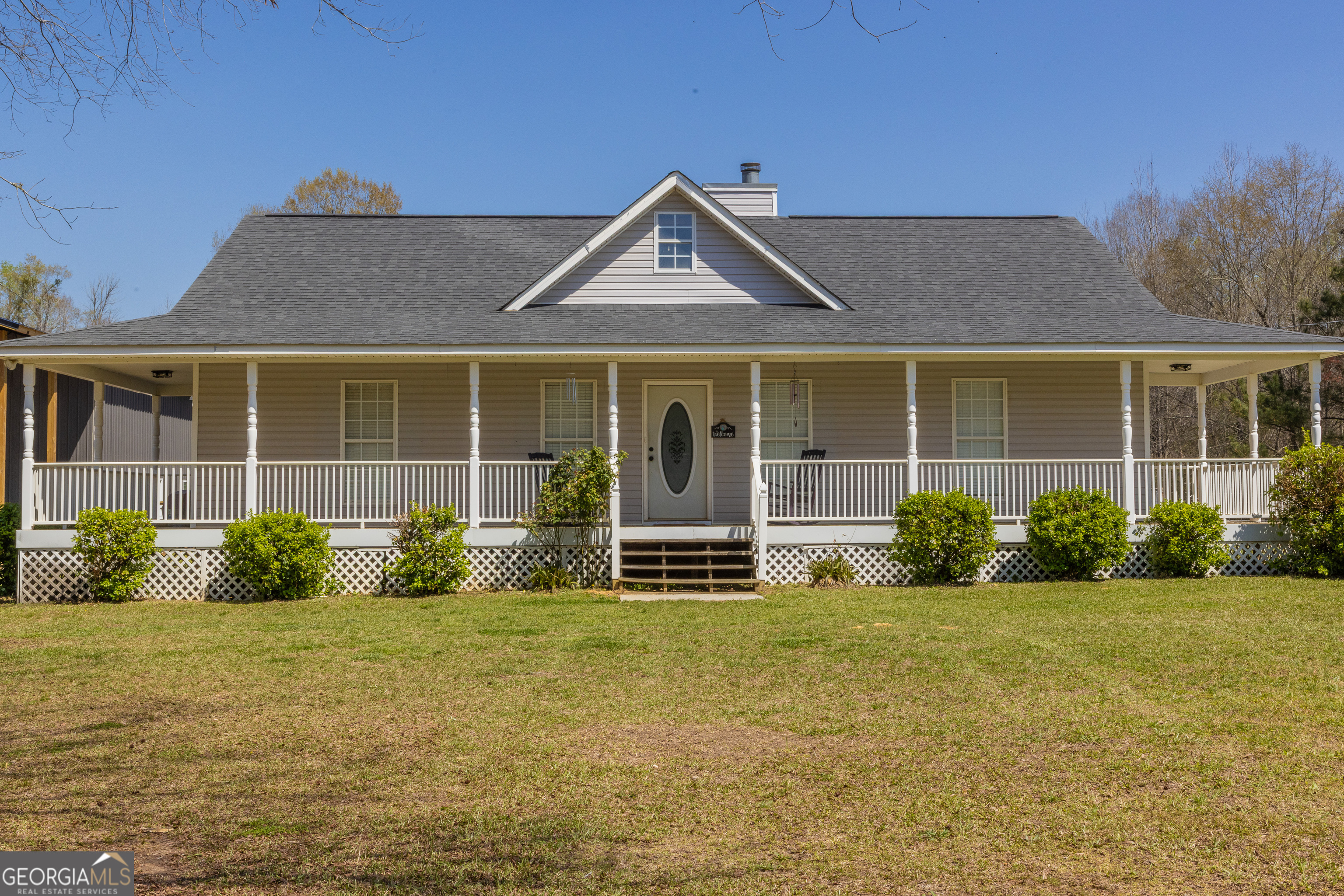 647 Pine Valley Road Meansville, GA 30256 - Photo 82 of 92 a front view of a house with garden