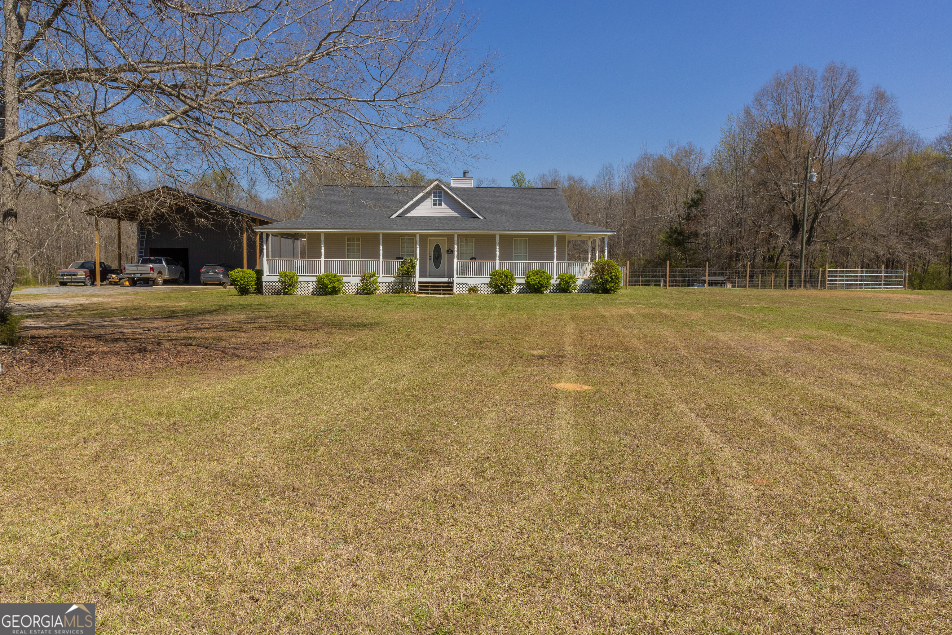 647 Pine Valley Road Meansville, GA 30256 - Photo 83 of 92 a front view of a building with a garden