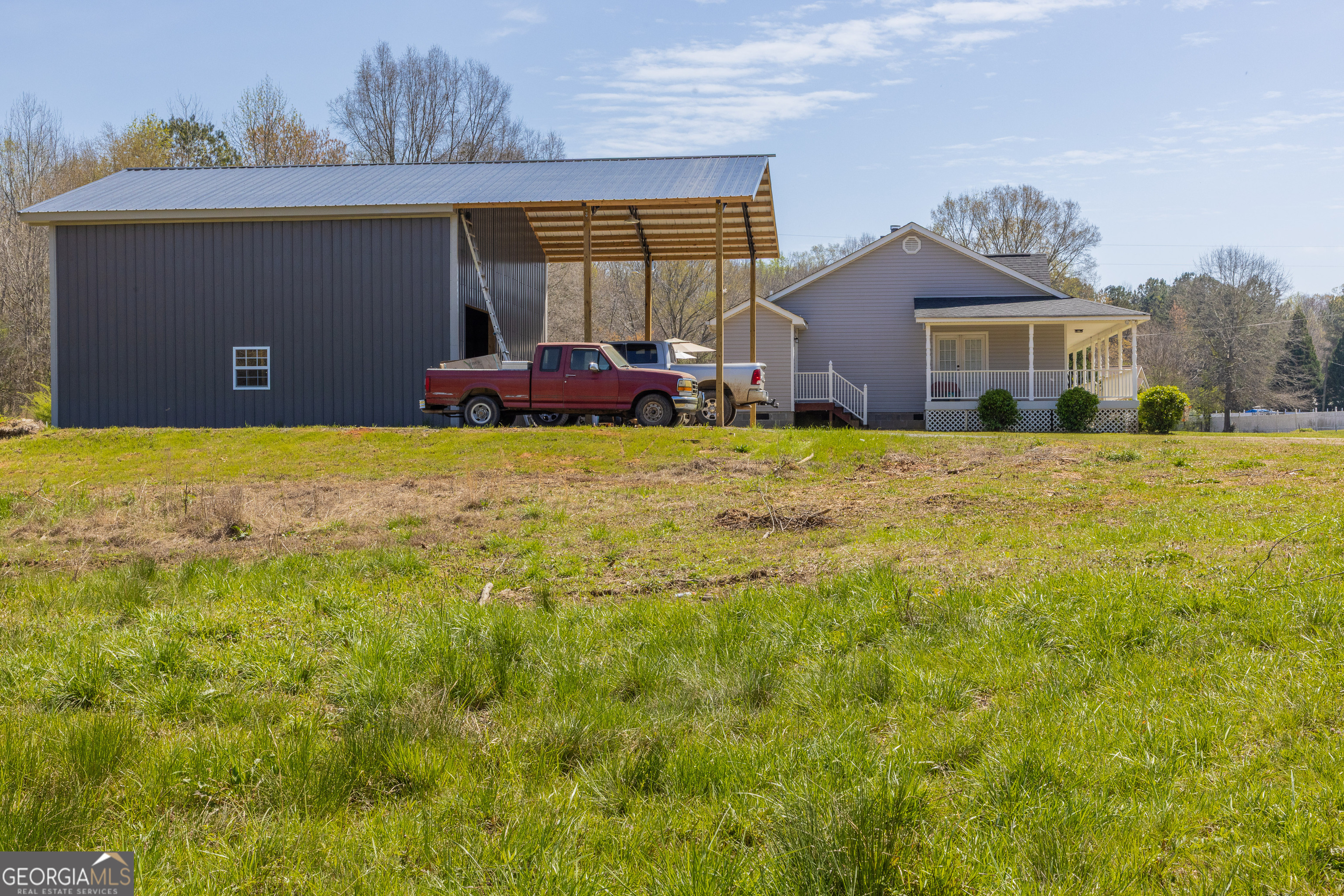 647 Pine Valley Road Meansville, GA 30256 - Photo 84 of 92 a front view of house with yard and trees in the background