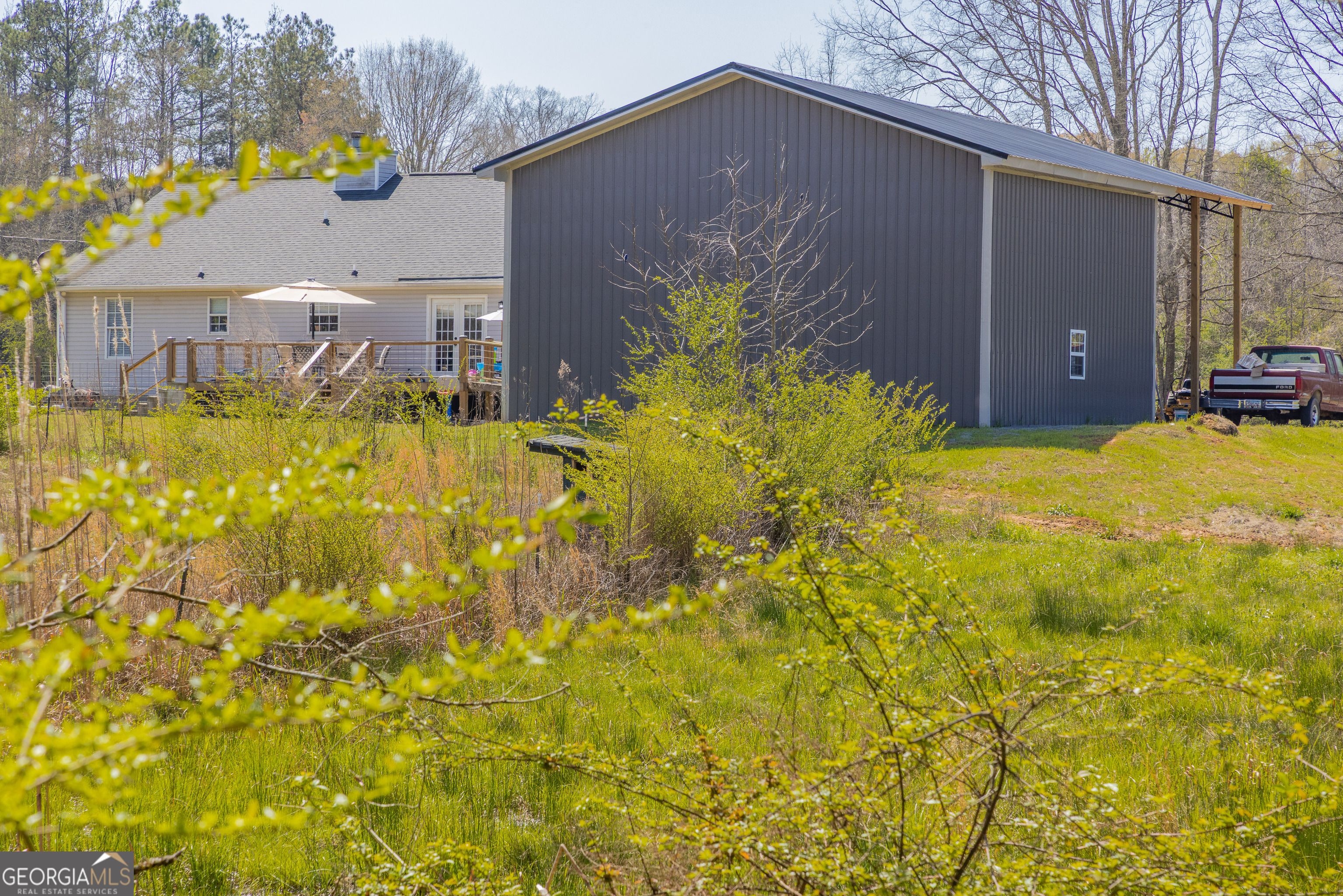 647 Pine Valley Road Meansville, GA 30256 - Photo 86 of 92 a aerial view of a house with swimming pool in front of house
