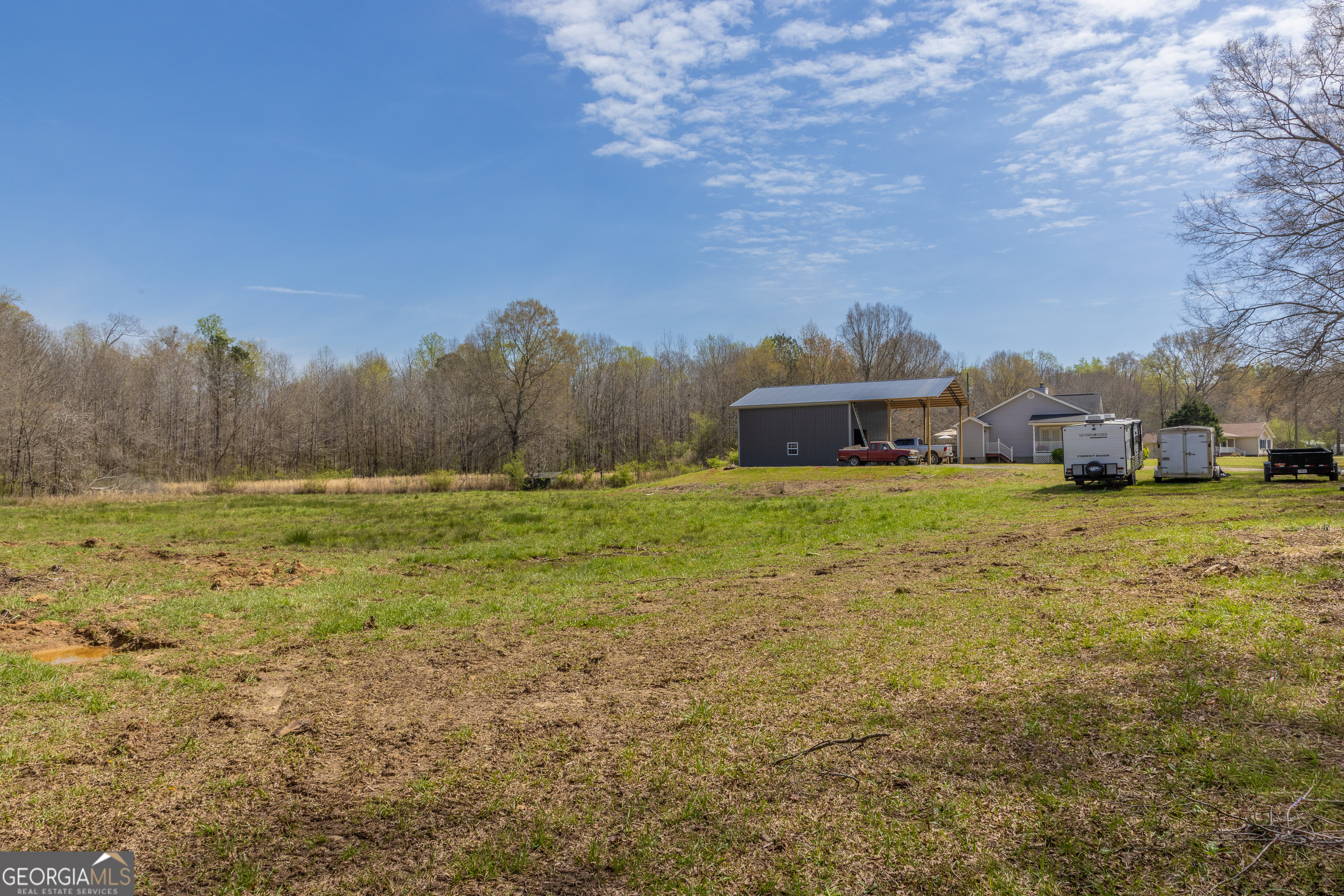 647 Pine Valley Road Meansville, GA 30256 - Photo 91 of 92 a view of a field with large trees