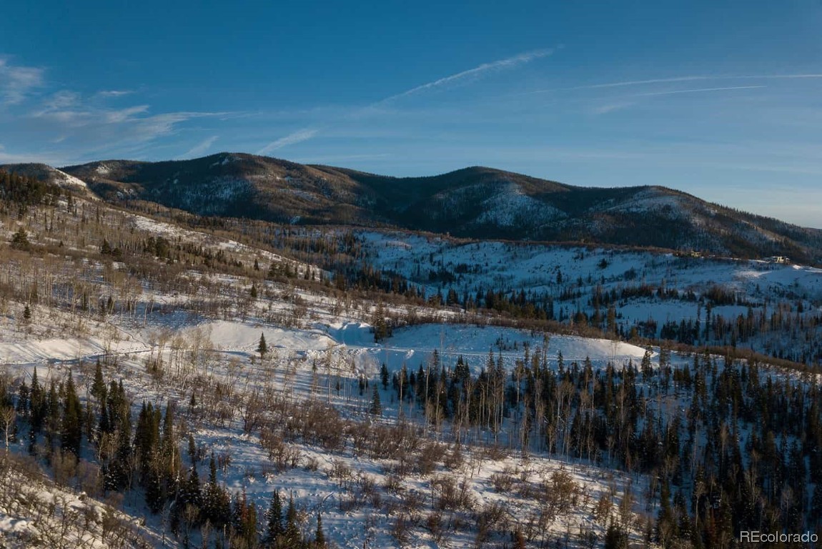 34950 Rockledge Road Steamboat Springs, CO 80487 - Photo 9 of 20 a view of a lake in middle of the forest