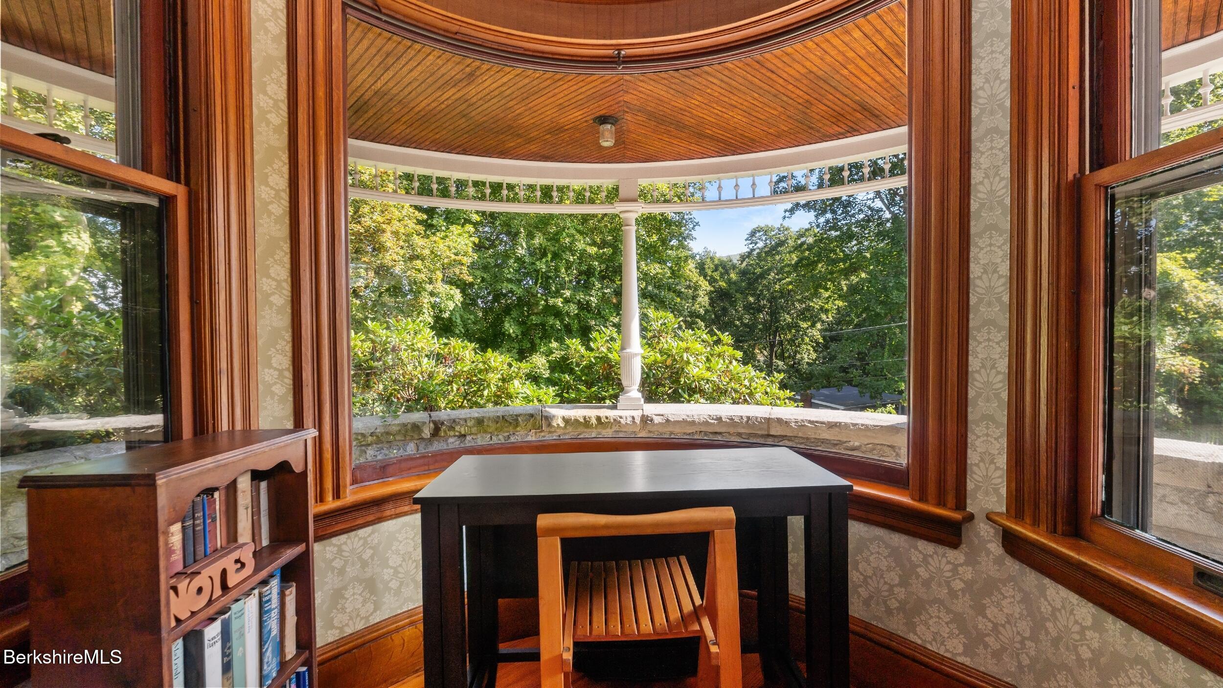 211 Cottage Street Great Barrington, MA 01236 - Photo 20 of 53 a view of a porch with a table and chairs