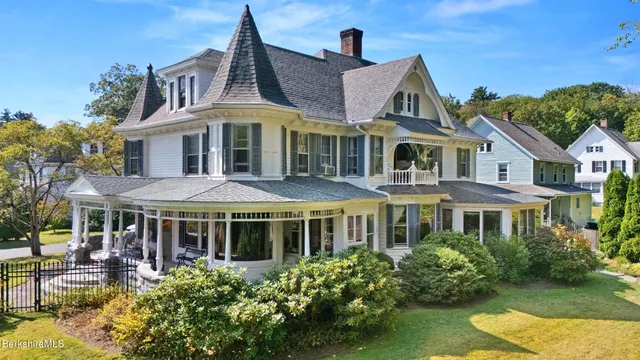 a front view of a house with yard porch and furniture