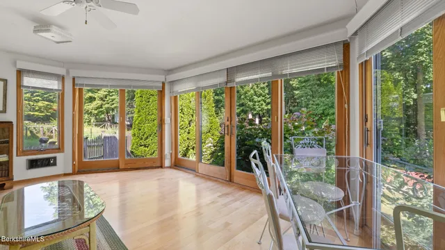 a view of staircase with wooden floor and a window