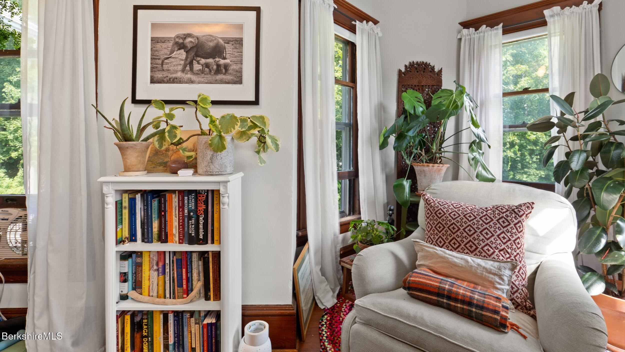 211 Cottage Street Great Barrington, MA 01236 - Photo 36 of 53 a view of living room with furniture and book shelf