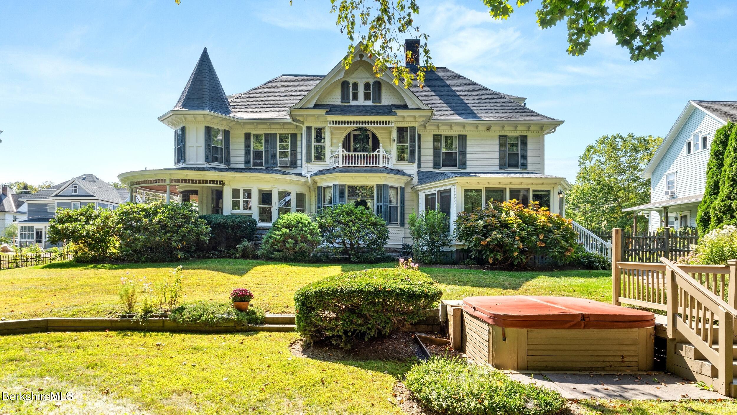 211 Cottage Street Great Barrington, MA 01236 - Photo 46 of 53 a front view of a house with a yard table and chairs