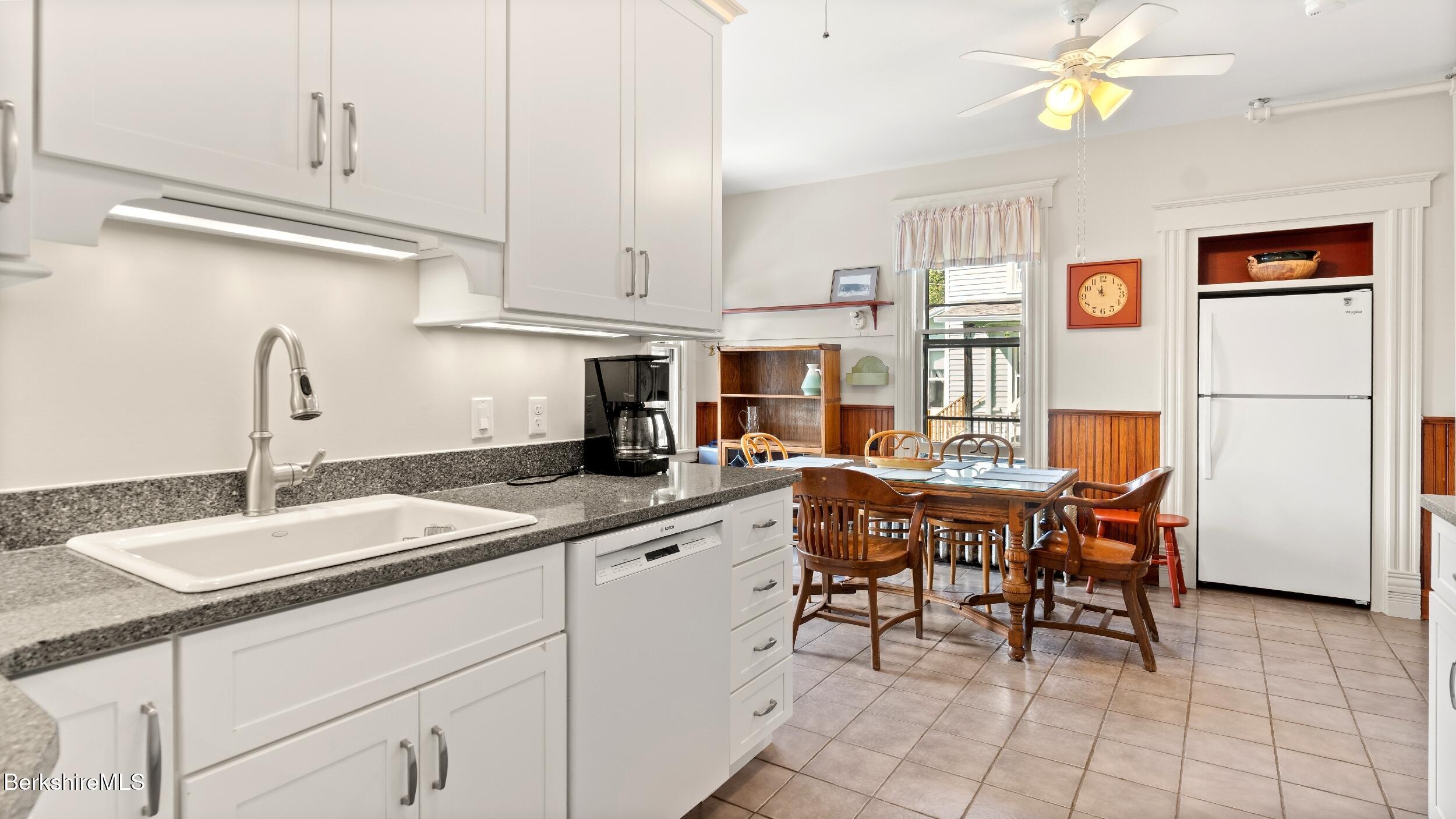 211 Cottage Street Great Barrington, MA 01236 - Photo 6 of 53 a kitchen with stainless steel appliances granite countertop a sink and cabinets