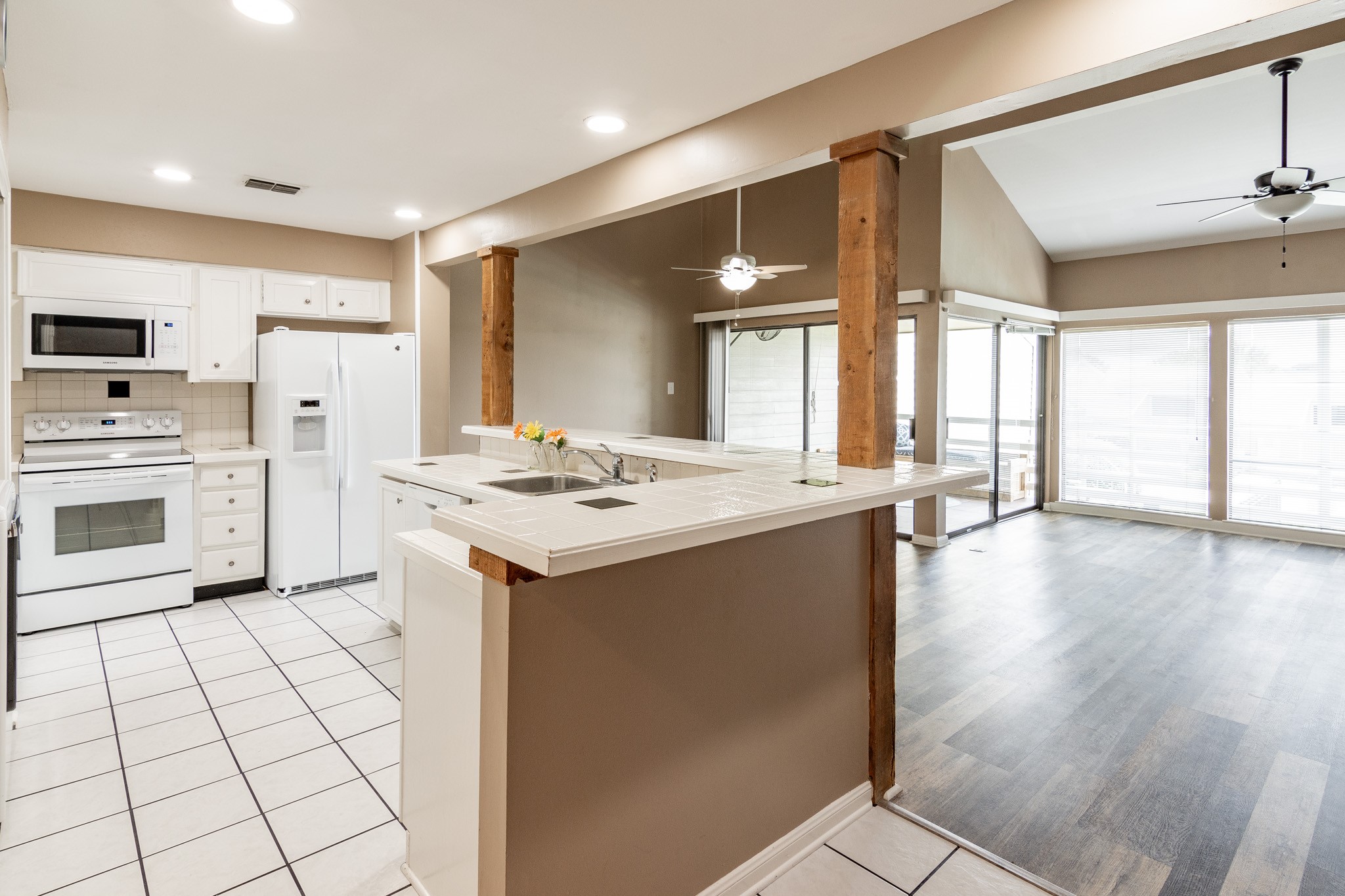 44 April Point Drive South Montgomery, TX 77356 - Photo 11 of 29 a kitchen with a sink cabinets and wooden floor