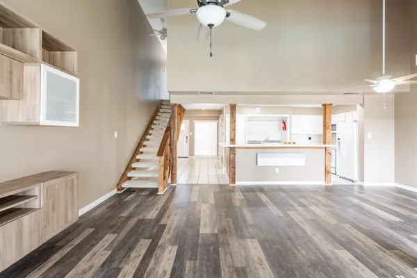 a view of kitchen with cabinets and wooden floor