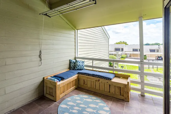 a room with window and a table chair