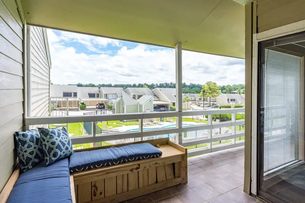 a view of a floor to ceiling window with wooden floor