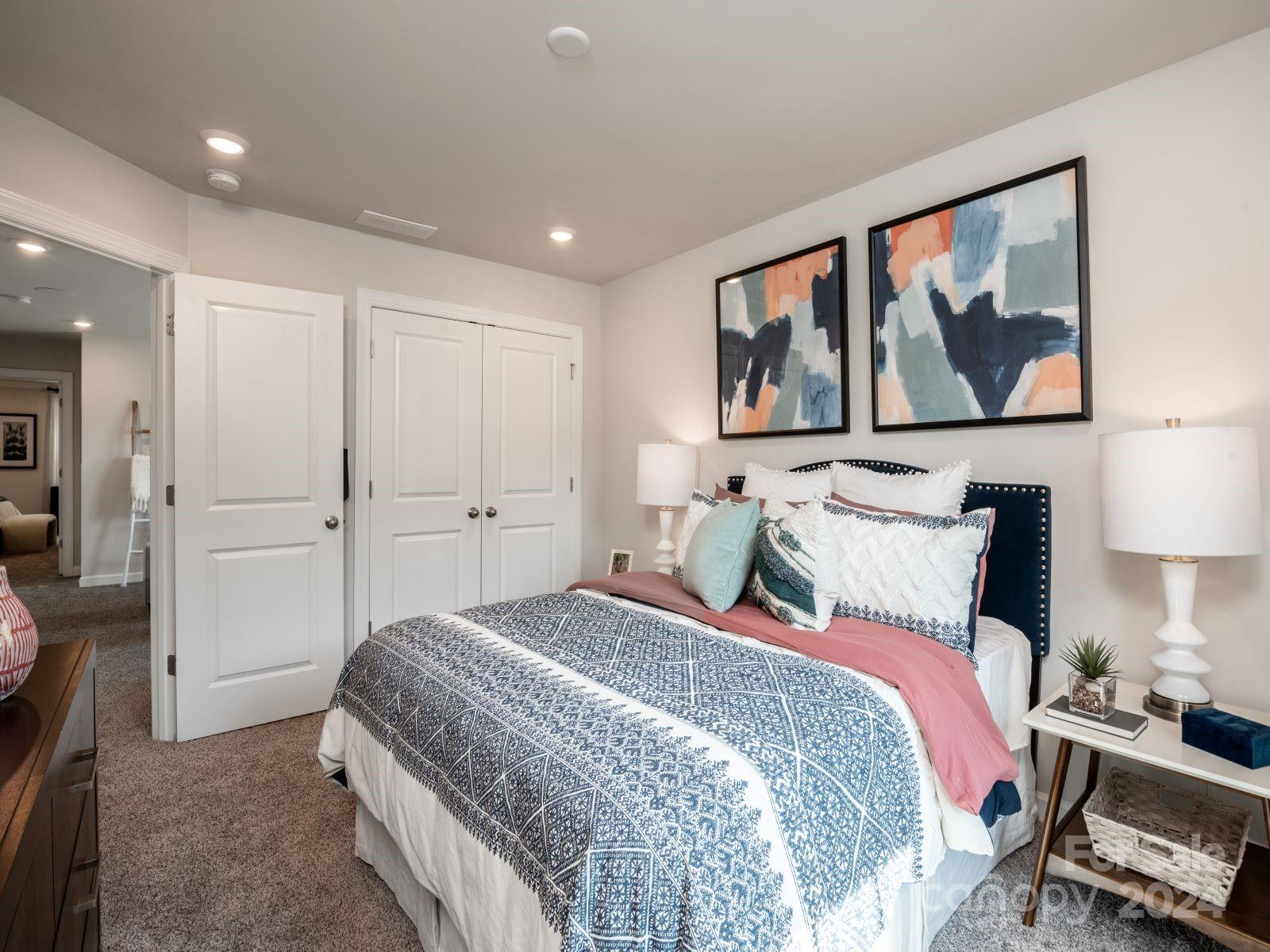 321 Cranford Drive Pineville, NC 28134 - Photo 9 of 14 a bedroom with a large bed and a painting on the wall