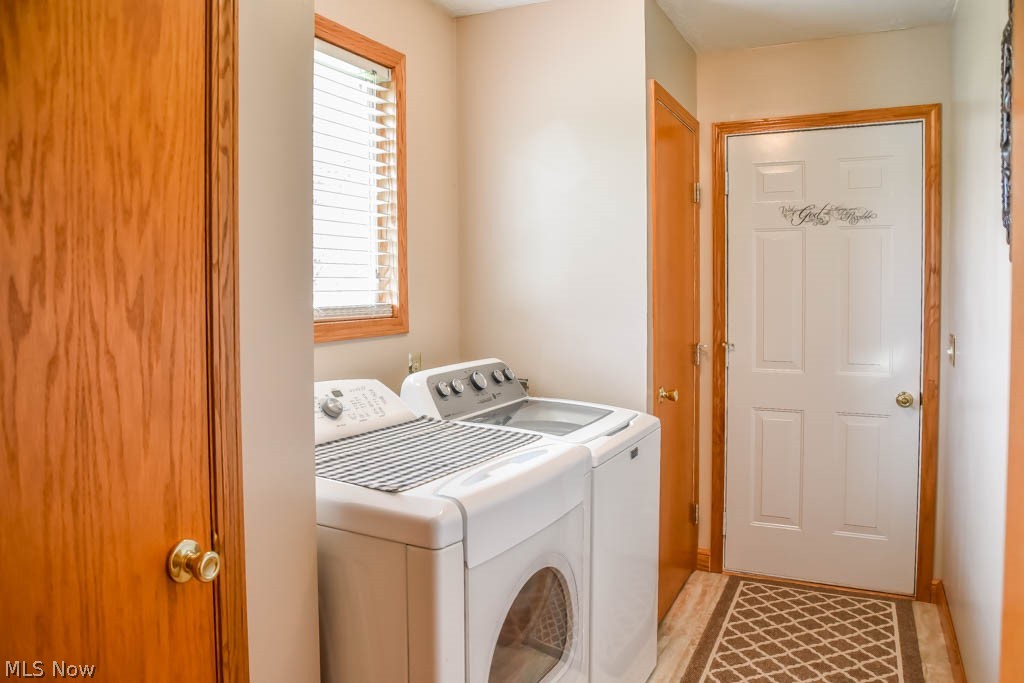 2651 Killian Road Uniontown, OH 44685 - Photo 20 of 25 First floor laundry room off of the kitchen with a coat closet and a pantry.