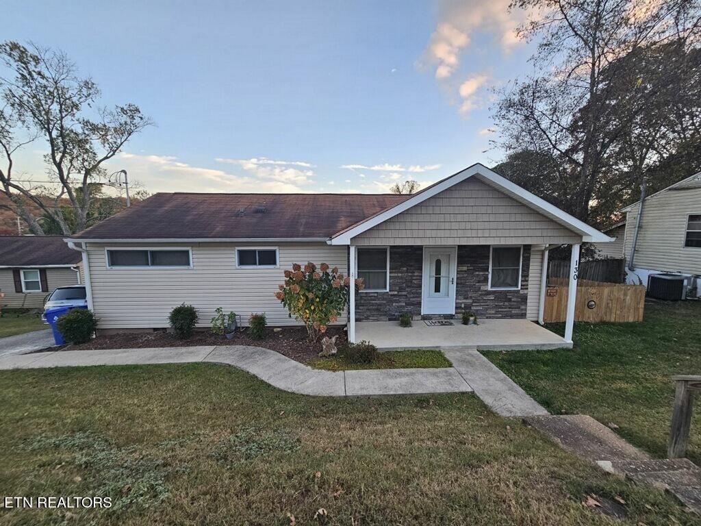 130 East Arrowwood Road Oak Ridge, TN 37830 - Photo 1 of 43 a front view of a house with a yard and porch