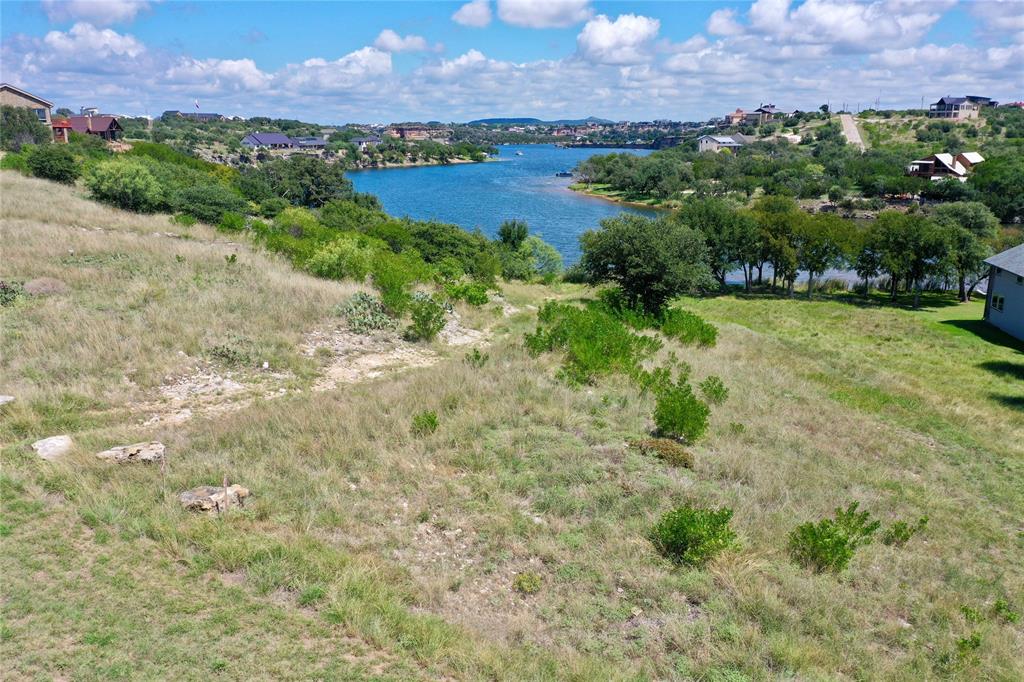 7084 Hells Gate Loop Strawn, TX 76475 - Photo 2 of 12 a view of lake with mountain