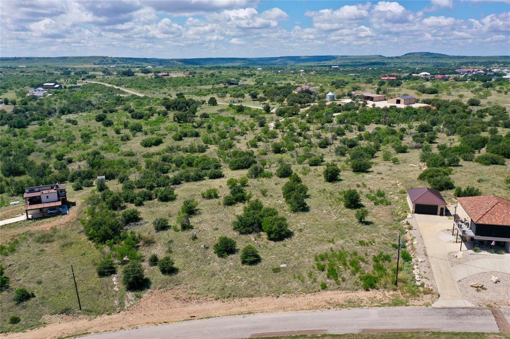 7084 Hells Gate Loop Strawn, TX 76475 - Photo 5 of 12 an aerial view of a house with a yard
