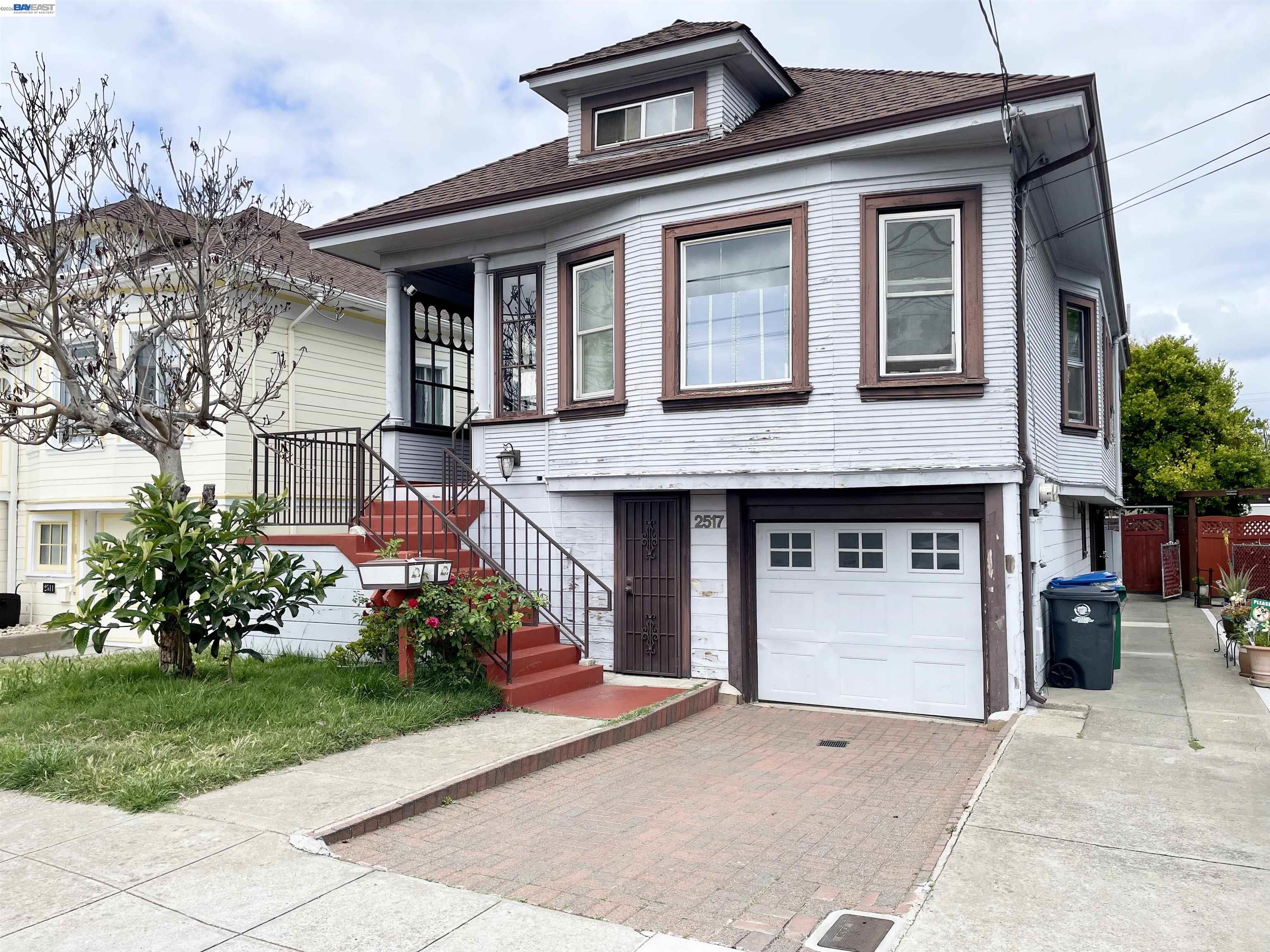 2517 Webb Avenue Alameda, CA 94501 - Photo 1 of 17 a front view of a house with a yard and garage
