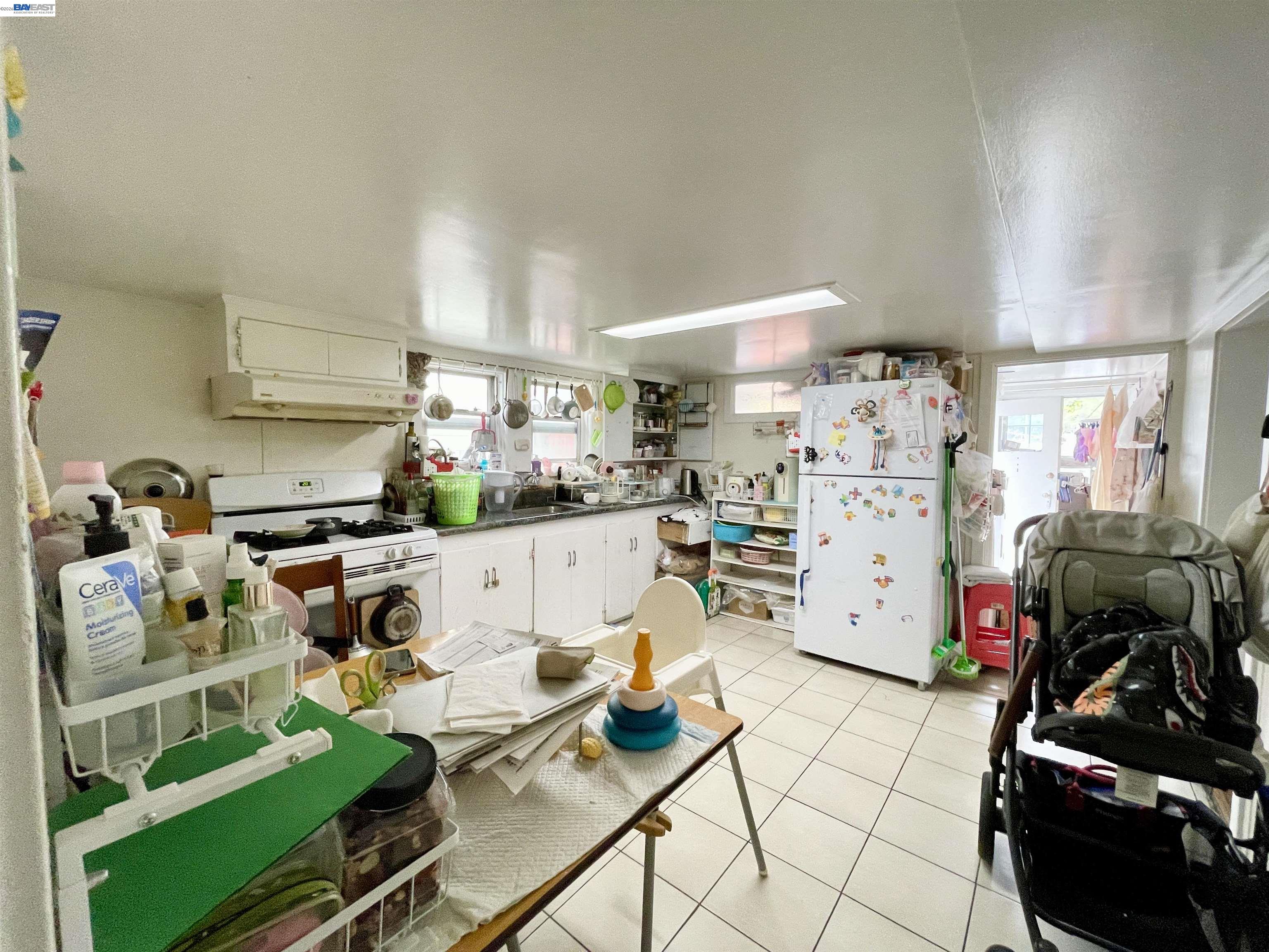 2517 Webb Avenue Alameda, CA 94501 - Photo 12 of 17 a living room with lots of furniture and gym equipment