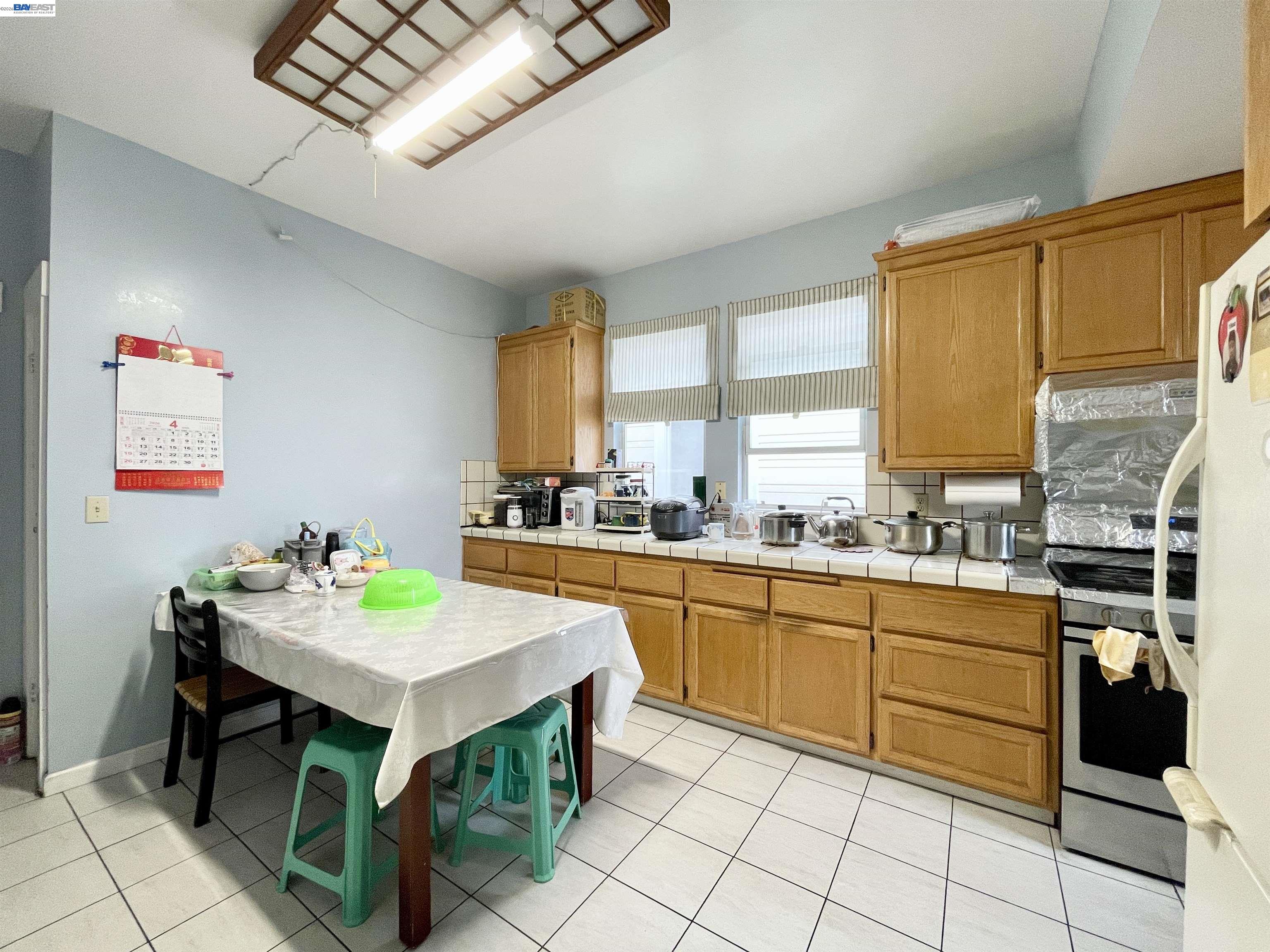 2517 Webb Avenue Alameda, CA 94501 - Photo 4 of 17 a kitchen with a sink cabinets and window