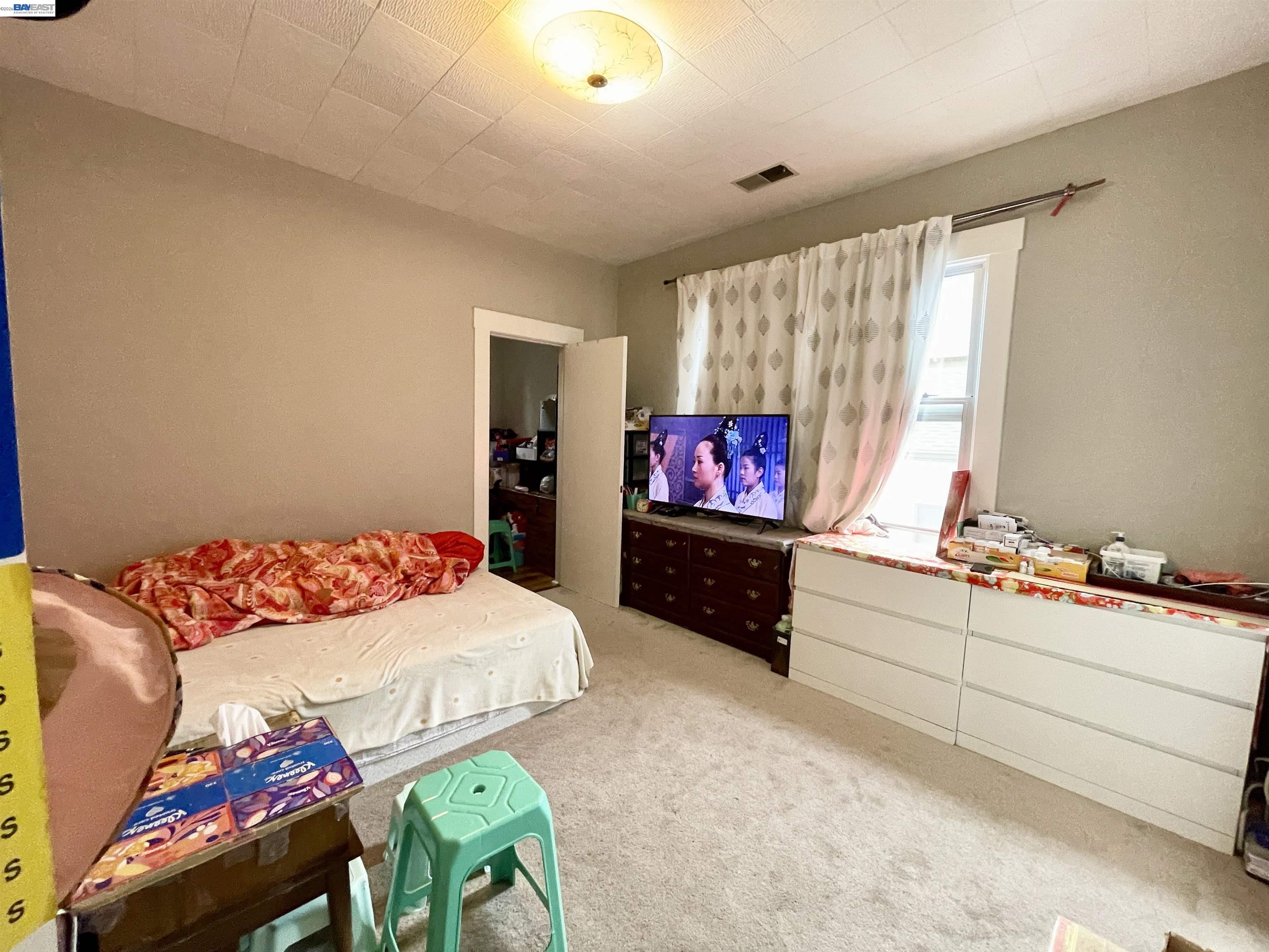 2517 Webb Avenue Alameda, CA 94501 - Photo 6 of 17 a bedroom with furniture and a flat screen tv
