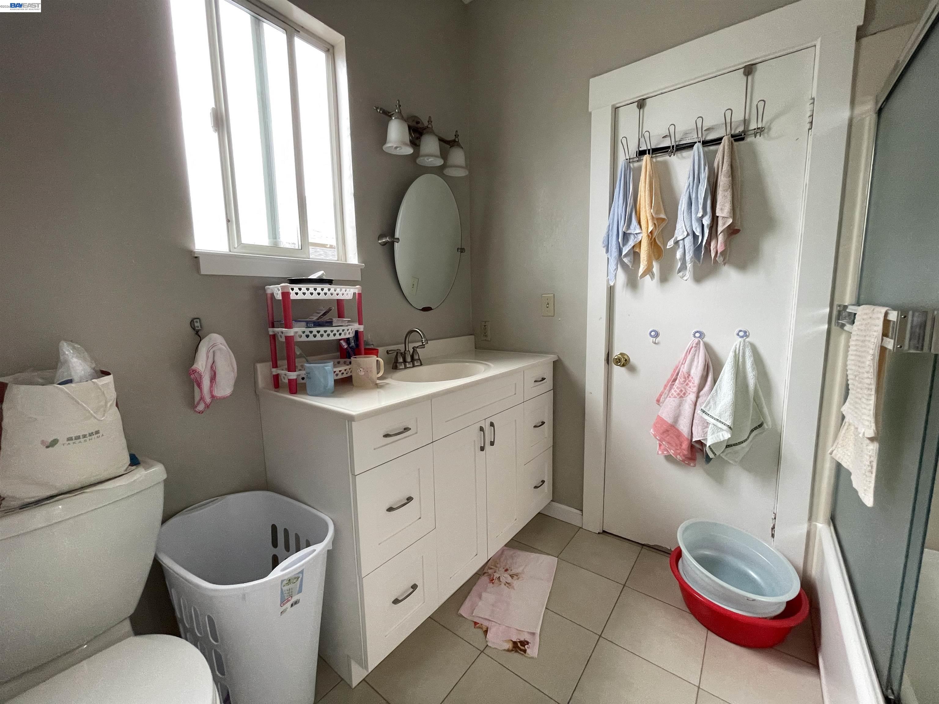 2517 Webb Avenue Alameda, CA 94501 - Photo 7 of 17 a bathroom with a sink toilet and shower