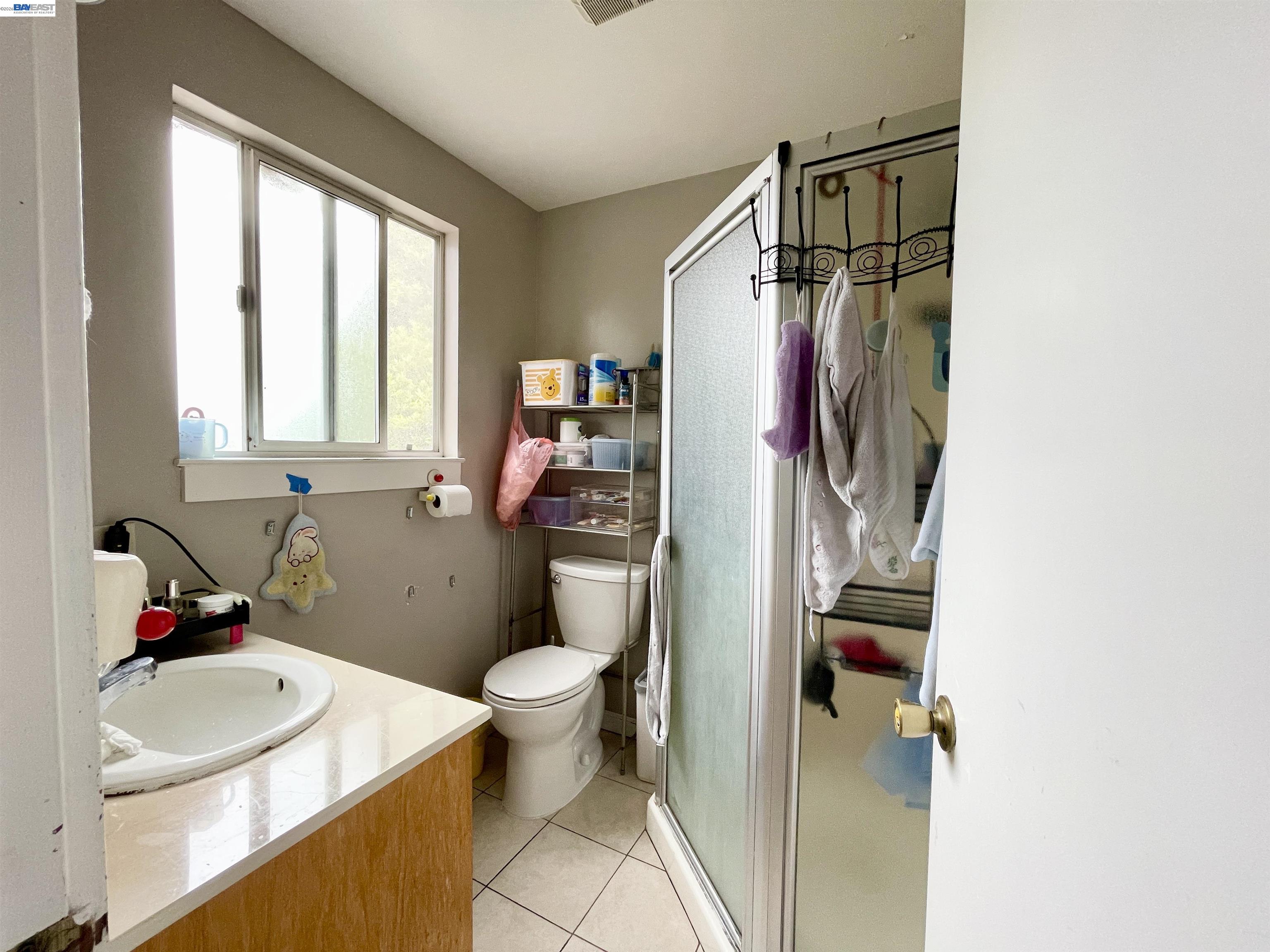 2517 Webb Avenue Alameda, CA 94501 - Photo 8 of 17 a bathroom with a sink toilet and shower