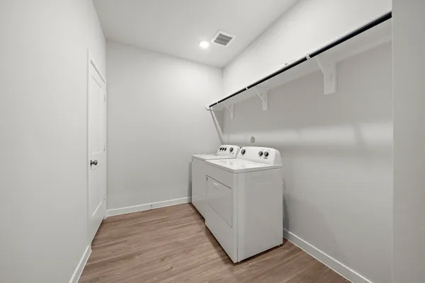 a utility room with washer and dryer