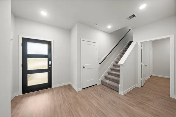 wooden floor in an empty room with a window and wooden floor