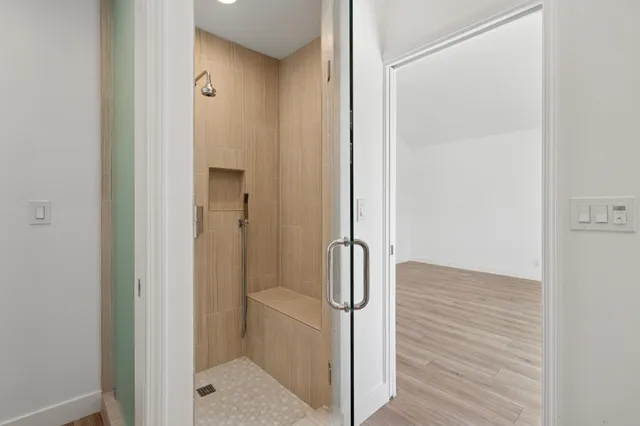 a view of a room with wooden floor