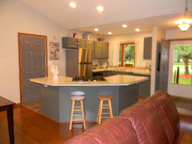 4193 Briargate Road Rockford, IL 61102 - Photo 6 of 25 a living room with stainless steel appliances granite countertop furniture a large window and a kitchen view